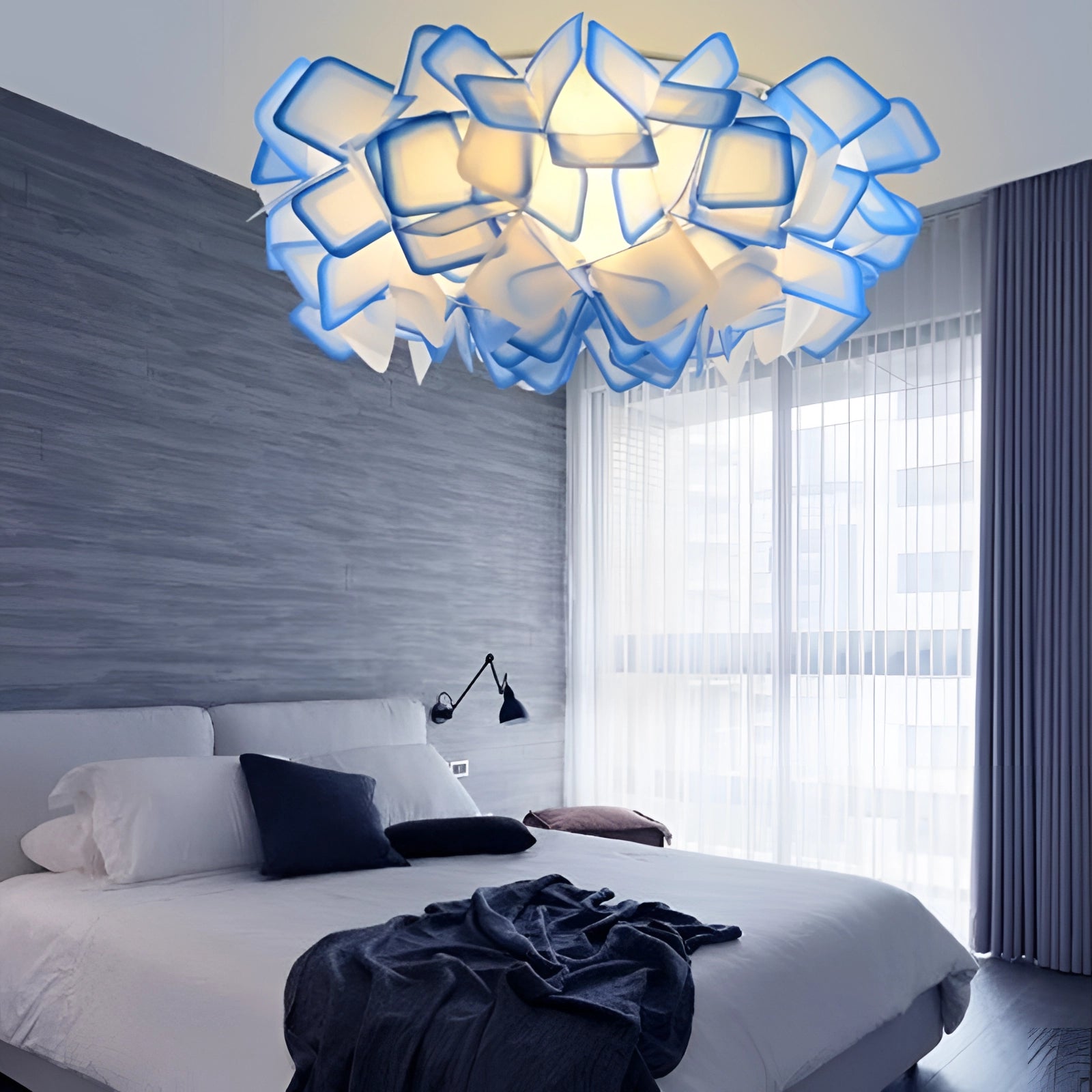 Modern geometric pendant light with a blue shade, measuring 27.5 inches by 9 inches, elegantly hangs from the ceiling, casting a warm and luxurious glow.