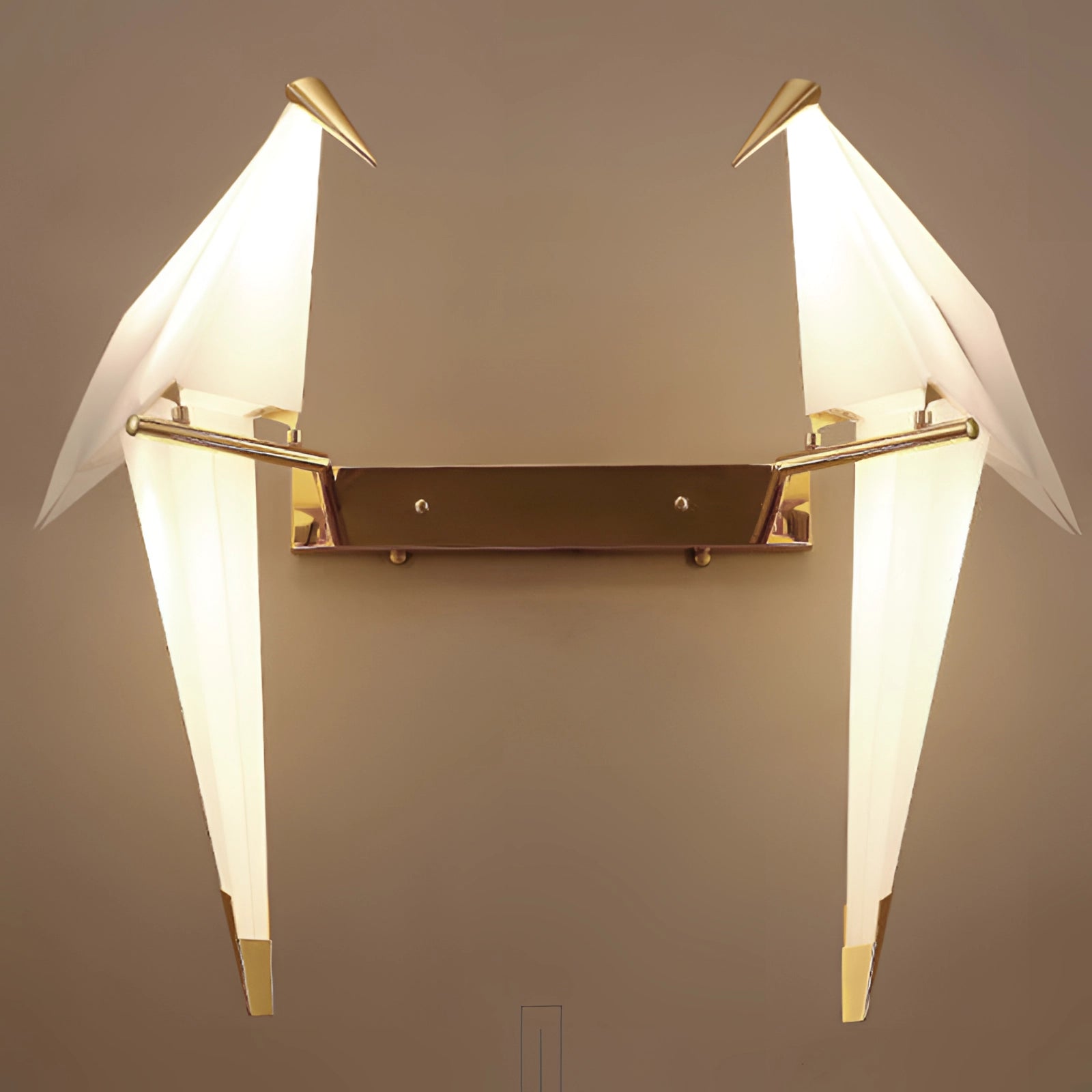 Modern geometric wall sconce featuring a triangular and rectangular design with copper accents, emitting a warm amber glow, suitable for artistic and creative home decor.