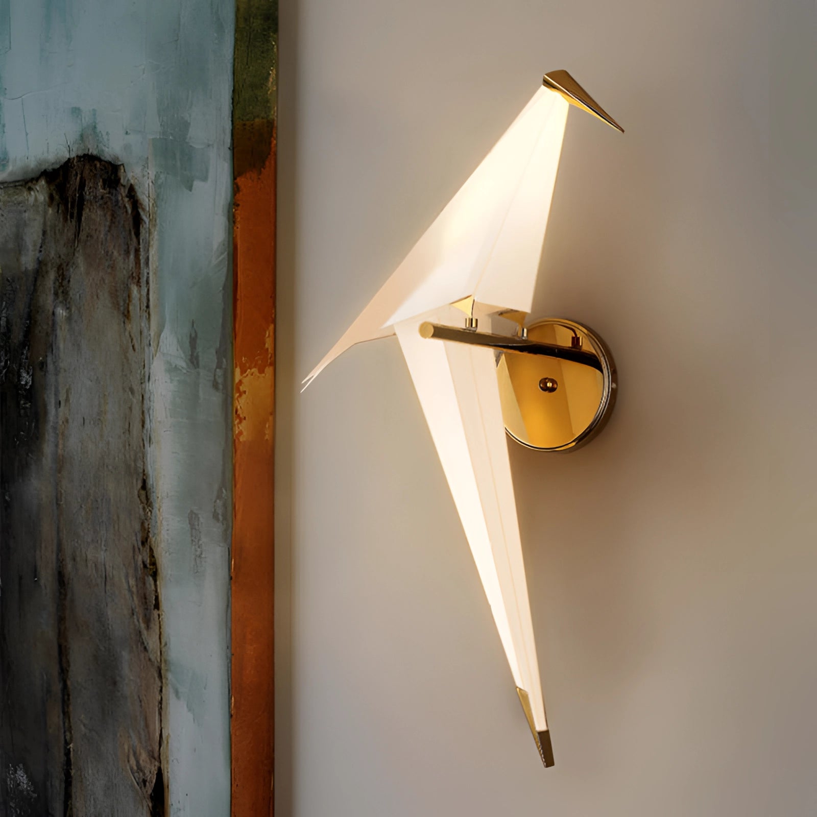 Modern geometric wall sconce with amber glow and copper accents, featuring a triangular design made of wood and plywood, mounted on a wall.