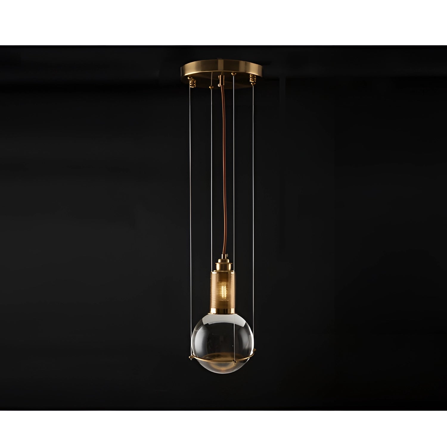 Modern glass globe pendant light with a minimalist gold finish, featuring a sleek and contemporary design suitable for designer lighting needs. The image shows the light fixture suspended from the ceiling, highlighting its elegant and stylish appearance.