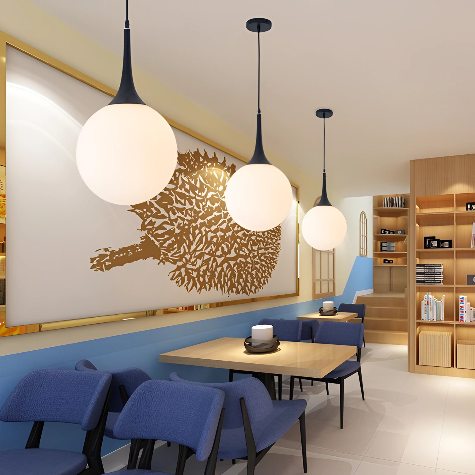 Black and white glass modern globe pendant light hanging from the ceiling in a well-decorated living room with shelves, books, and a table.