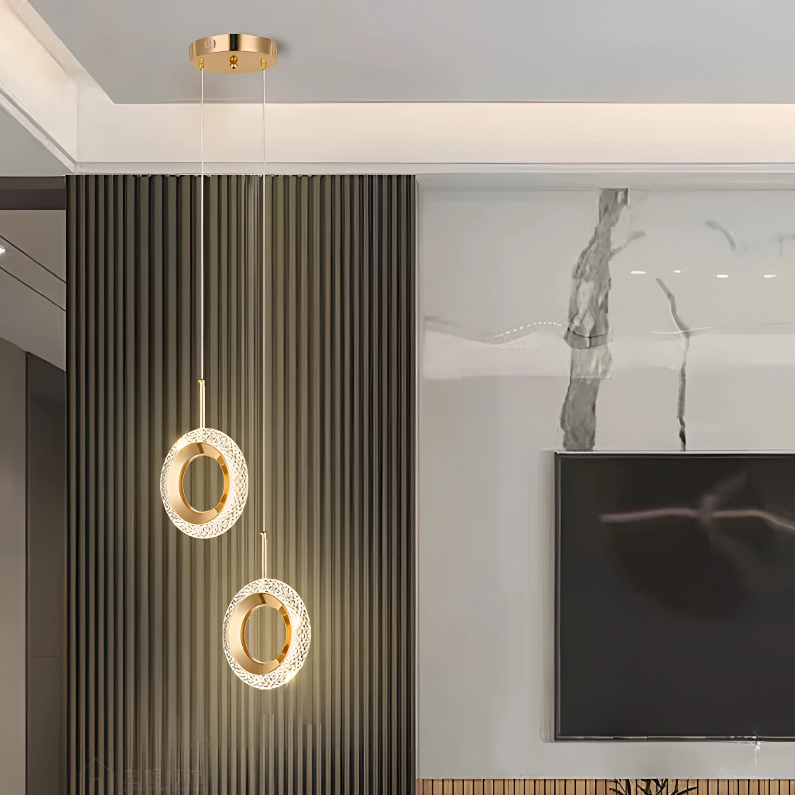 Modern gold LED chandelier with a luxury designer pendant light, featuring a sleek rectangular design, illuminated and suspended from the ceiling in a stylish interior space.