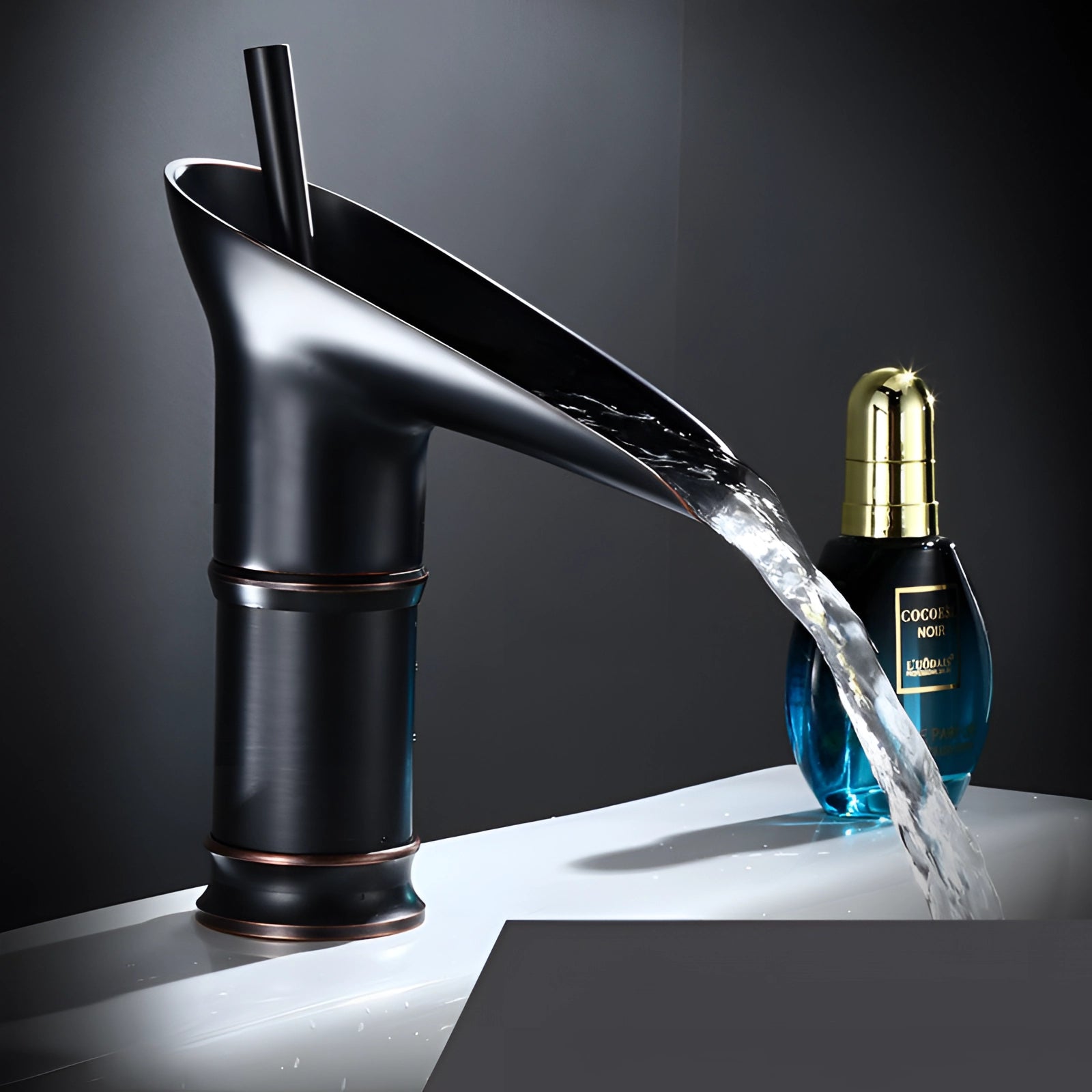 Modern gold waterfall faucet with a sleek design made from luxury brass, shown installed on a vessel sink, emphasizing its elegant fluid flow and contemporary plumbing fixture aesthetics.