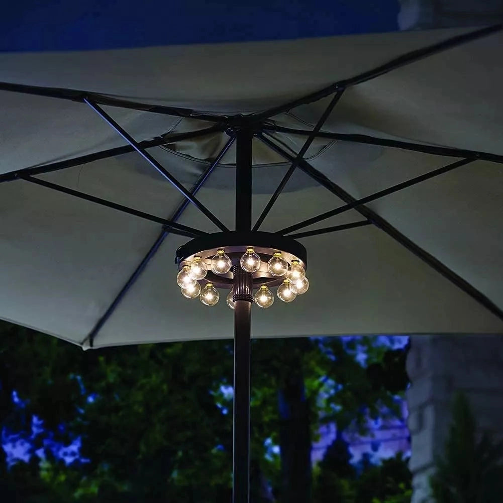 Modern industrial round chandelier with exposed filament bulbs hanging from the ceiling, showcasing glass shades and metal accents with a clear sky and tree visible in the background.