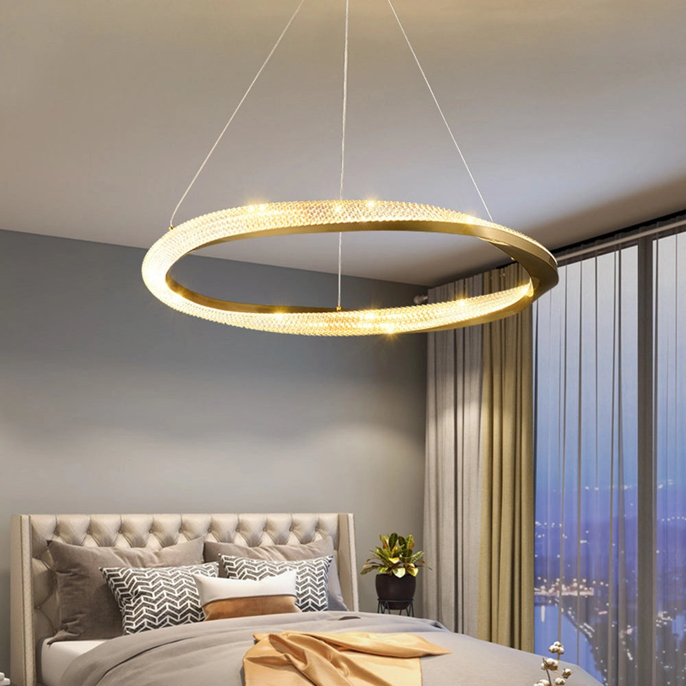 Modern gold LED chandelier with minimalist pendant light design, hanging from the ceiling.