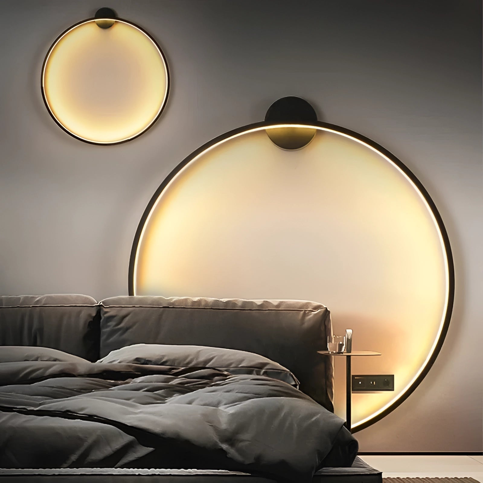 Modern LED circle wall lamp with a black and wood design, emitting a warm yellow light, enhancing the luxurious feel of a bedroom interior.