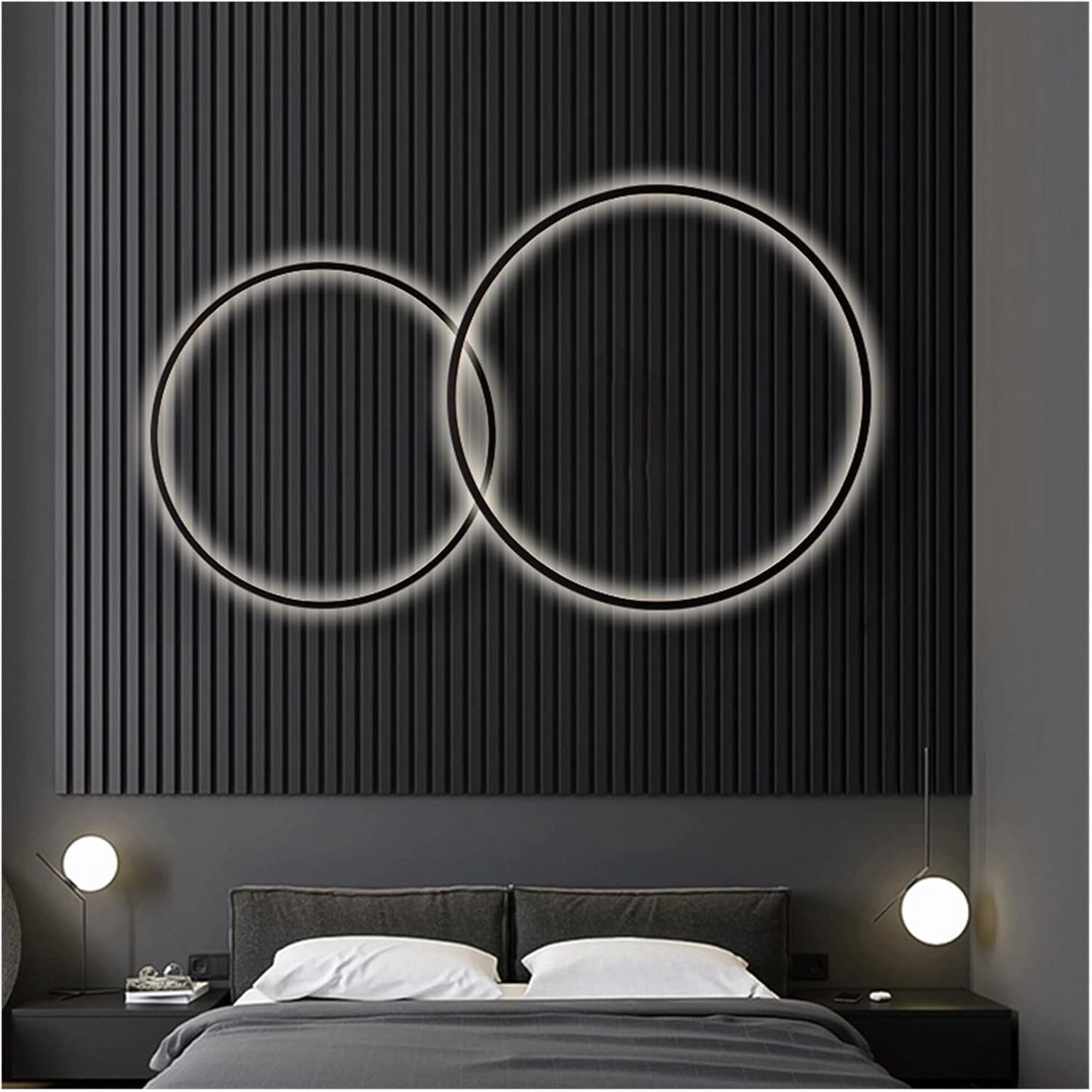 Modern LED circle wall lamp featuring a sleek black and white design, illuminating a luxury bedroom with its contemporary and stylish geometric shape.