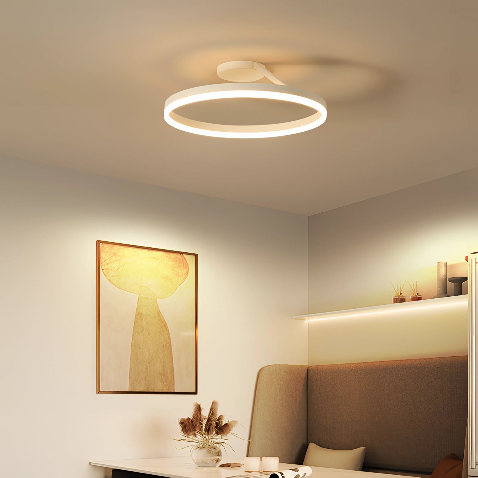 Modern LED circular ceiling light fixture with a sleek, energy-efficient design in white, featuring dimmable settings and down glow illumination, integrated into a stylishly furnished interior space.