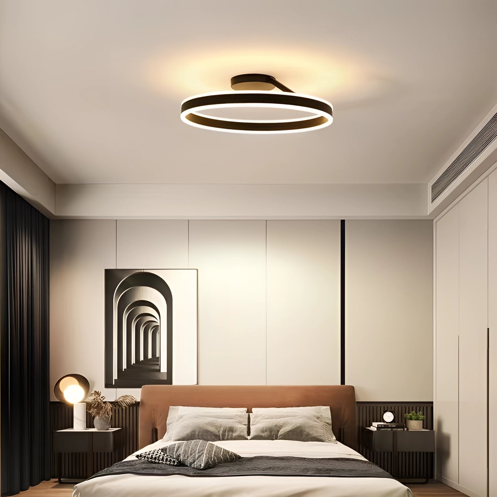 Modern LED circular ceiling light fixture with a sleek design, providing energy-efficient lighting in a stylish interior setting, featuring wooden elements and comfortable furnishings.