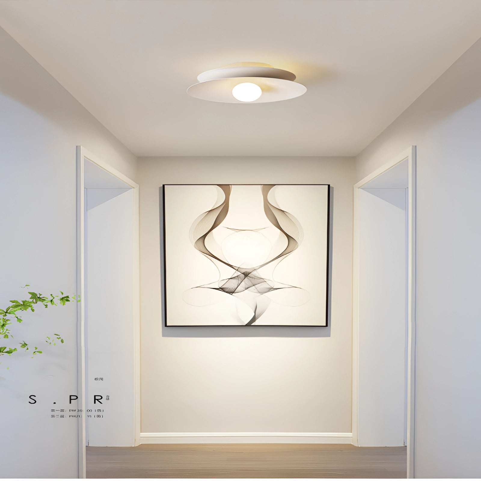 Modern LED disc ceiling light with a minimalist flush mount design, displayed in a room with a white ceiling and warm white illumination. The fixture is set against a backdrop featuring wooden accents and a simple, contemporary interior.