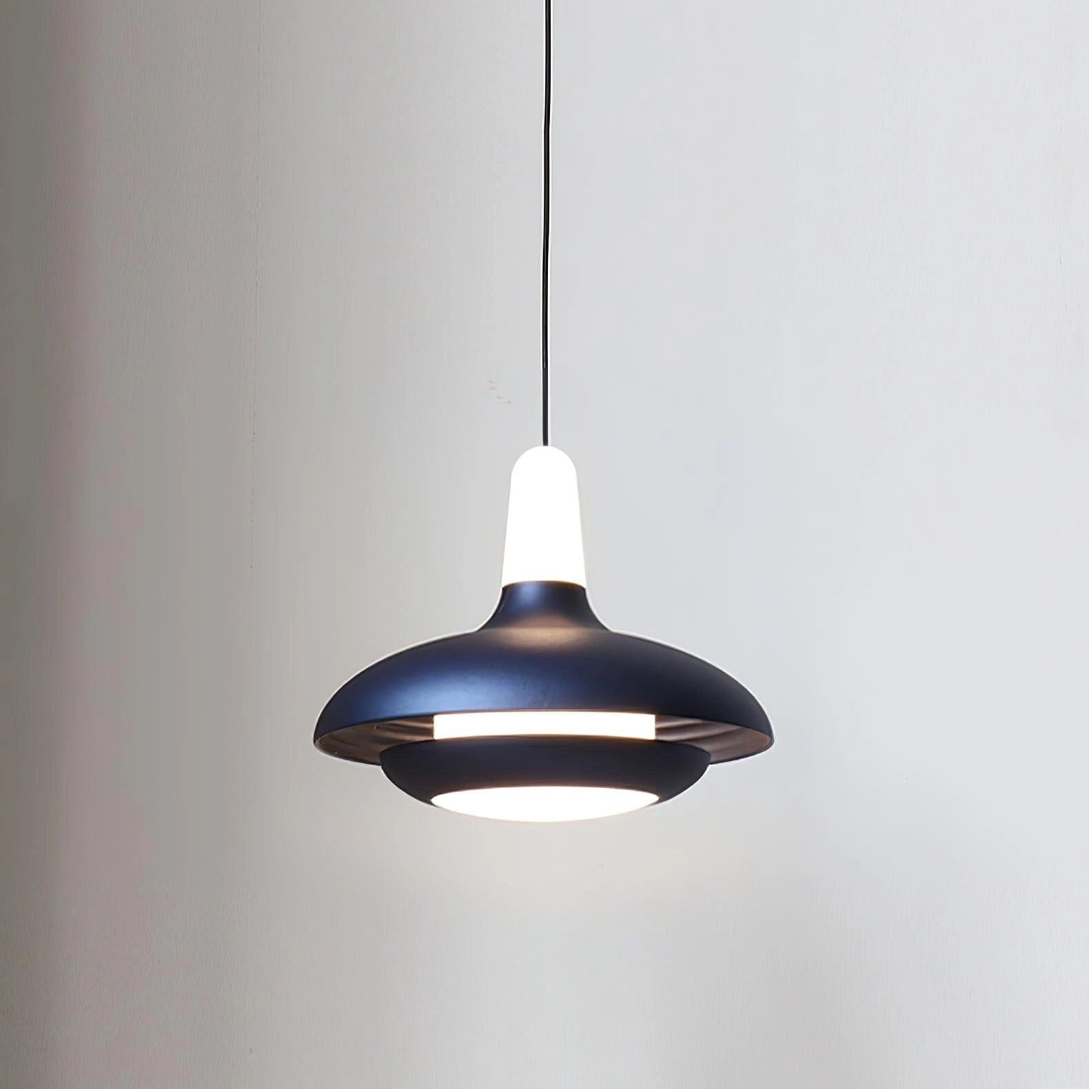 
A modern LED pendant light with a sleek minimalistic design, featuring an adjustable cord and a blue circular shade. The light is mounted as a ceiling fixture, emitting a bright, clean illumination.