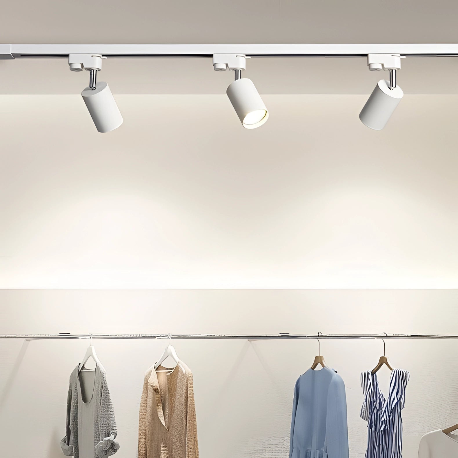 Modern white LED track lighting fixture with three adjustable ceiling spotlights mounted on a 39.37-inch spur.