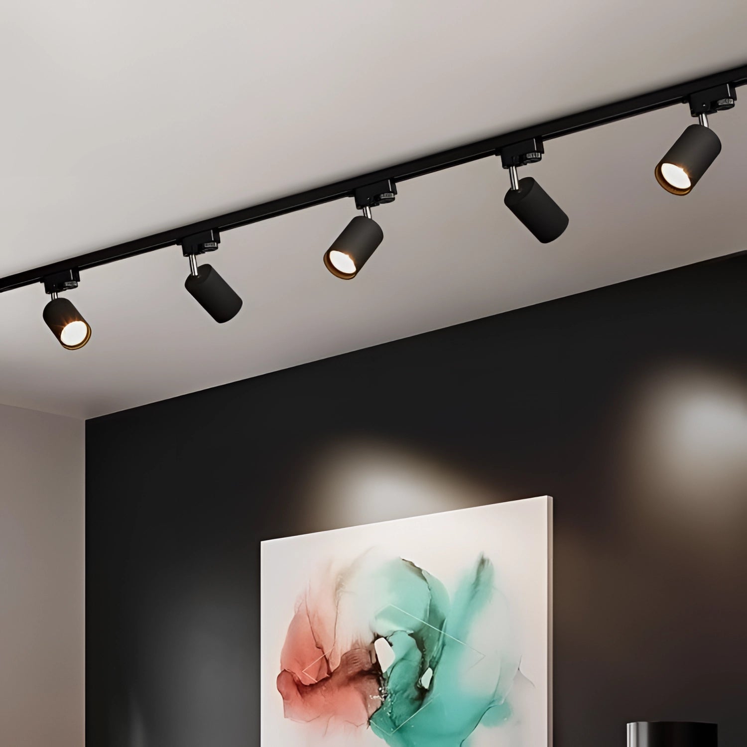 Modern black LED track lighting fixture with four adjustable spotlights mounted on a 59.06-inch rectangular ceiling spur, illuminating a contemporary interior space.