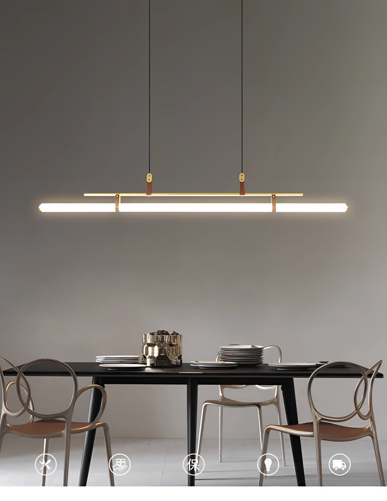 Modern LED tube pendant light hanging above a minimalist kitchen and dining room setup with a wooden rectangular table and chairs.