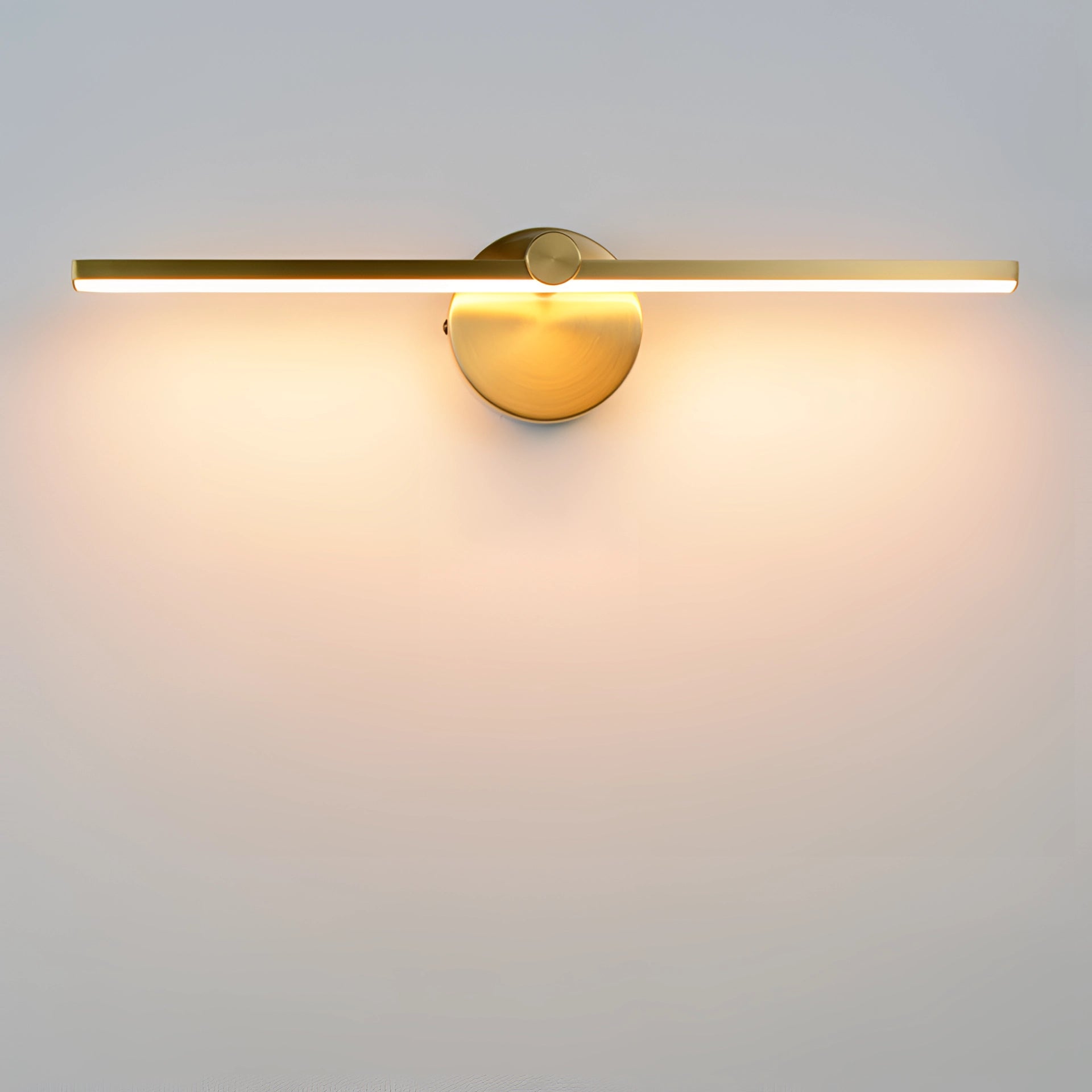 Modern LED wall sconce in brushed gold finish, mounted on a wooden surface, featuring energy-efficient lighting suitable for indoor use.