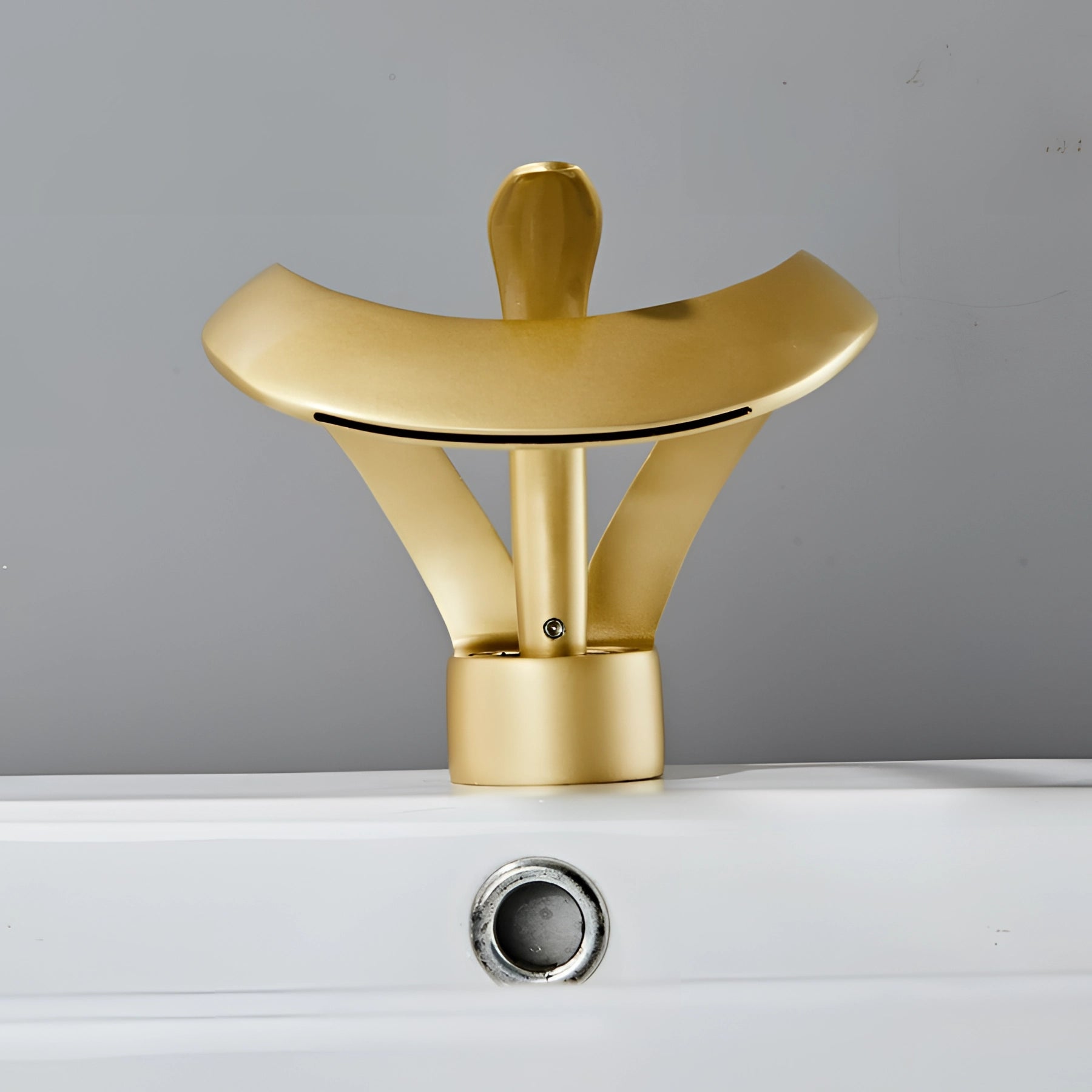 Modern matte black waterfall faucet with a sleek, minimalist design, featuring a wide spout for a cascading water effect, shown against a wooden backdrop.