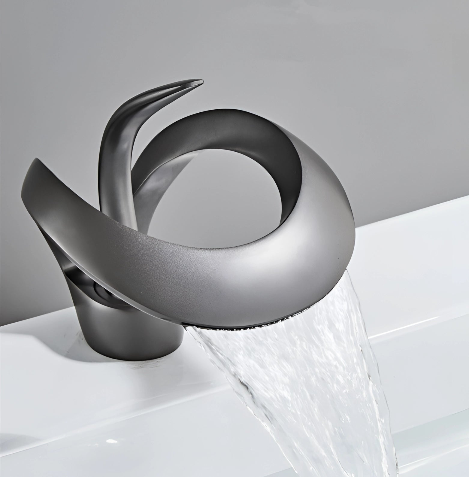 
A sleek modern matte black waterfall faucet with a futuristic design, featuring a smooth, circular base and a sculptural appearance, showcasing luxury craftsmanship and high-quality metal material.