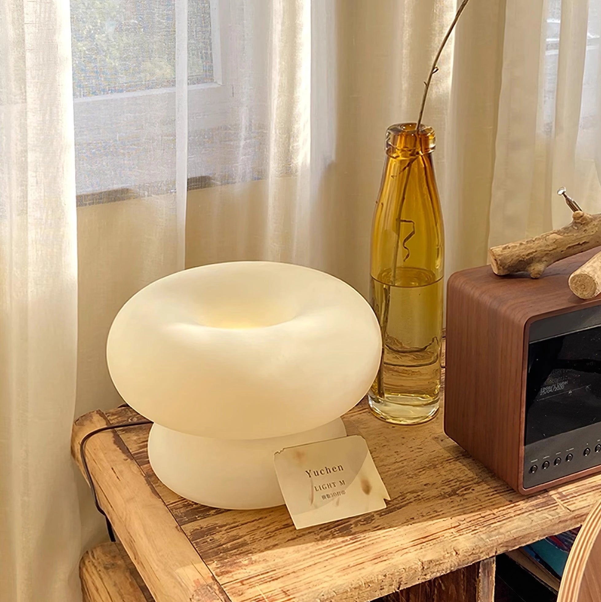 Modern Mushroom Table Lamp with minimalist design on a wooden bedside table in a beige-themed interior.