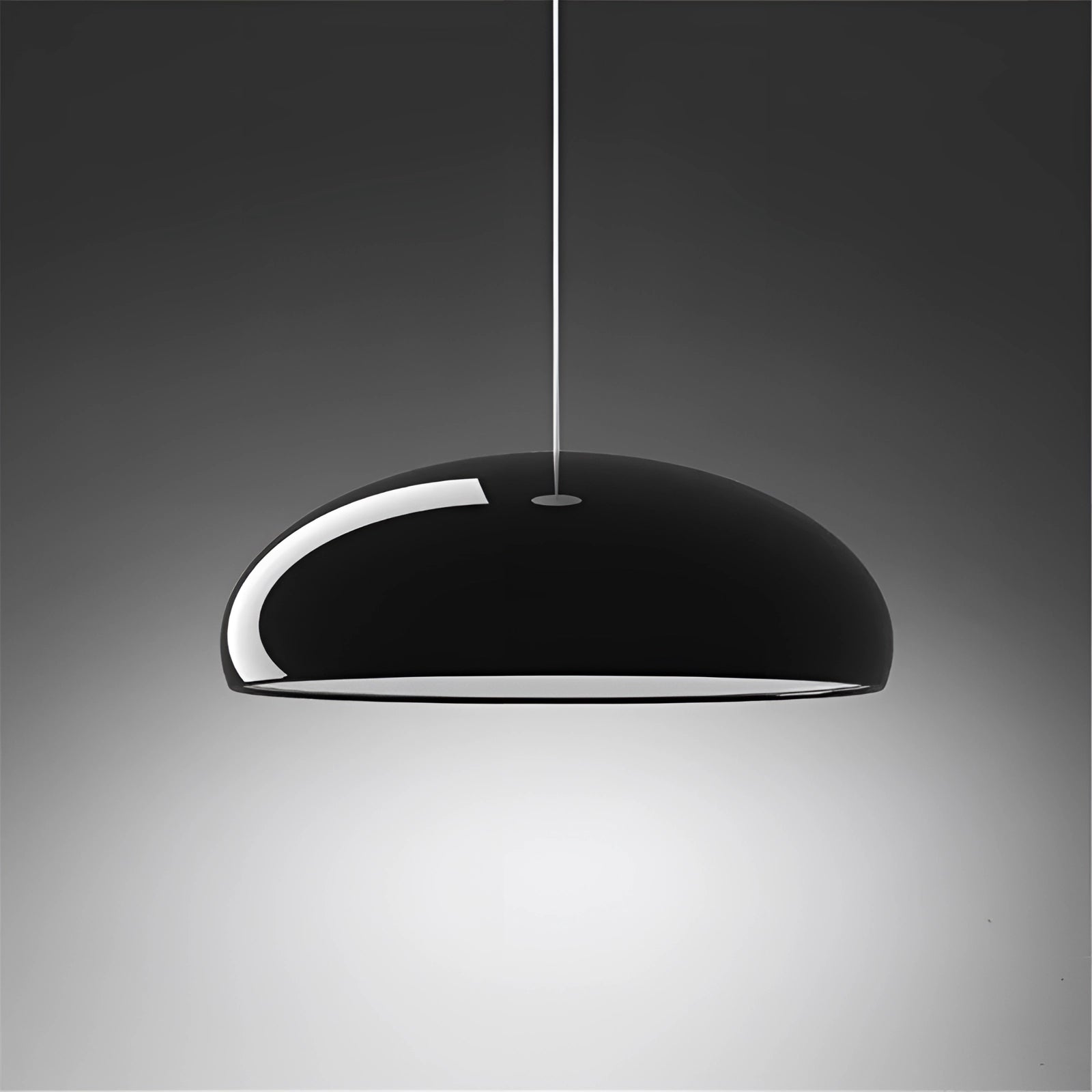 A sleek, modern oval pendant light with a minimalist Scandinavian design, featuring a white glass shade and a black finish, measuring 60 cm in length, hanging from the ceiling.