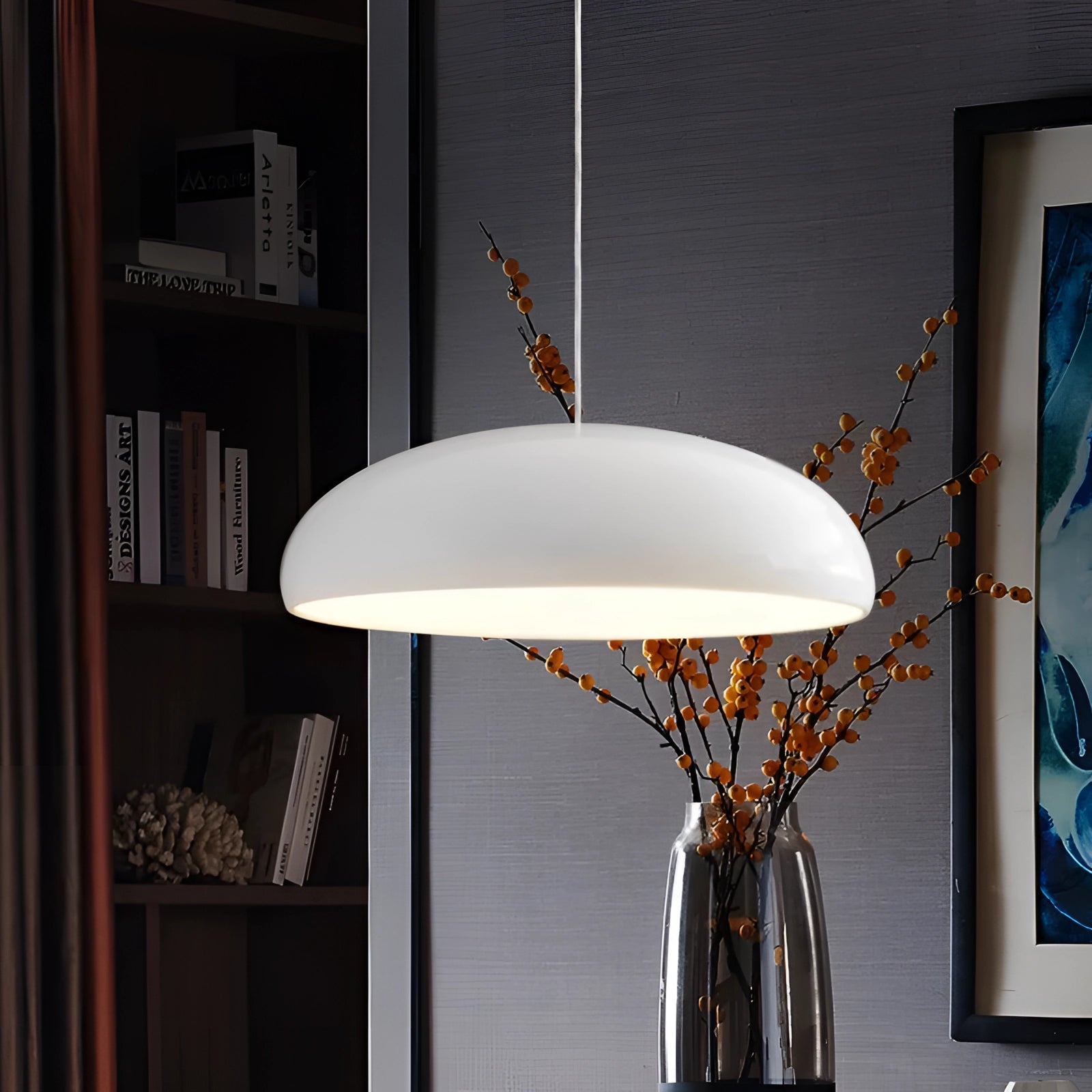 Modern oval pendant light with a white glass shade, featuring a Scandinavian minimalist design, hanging from a ceiling in an interior setting.