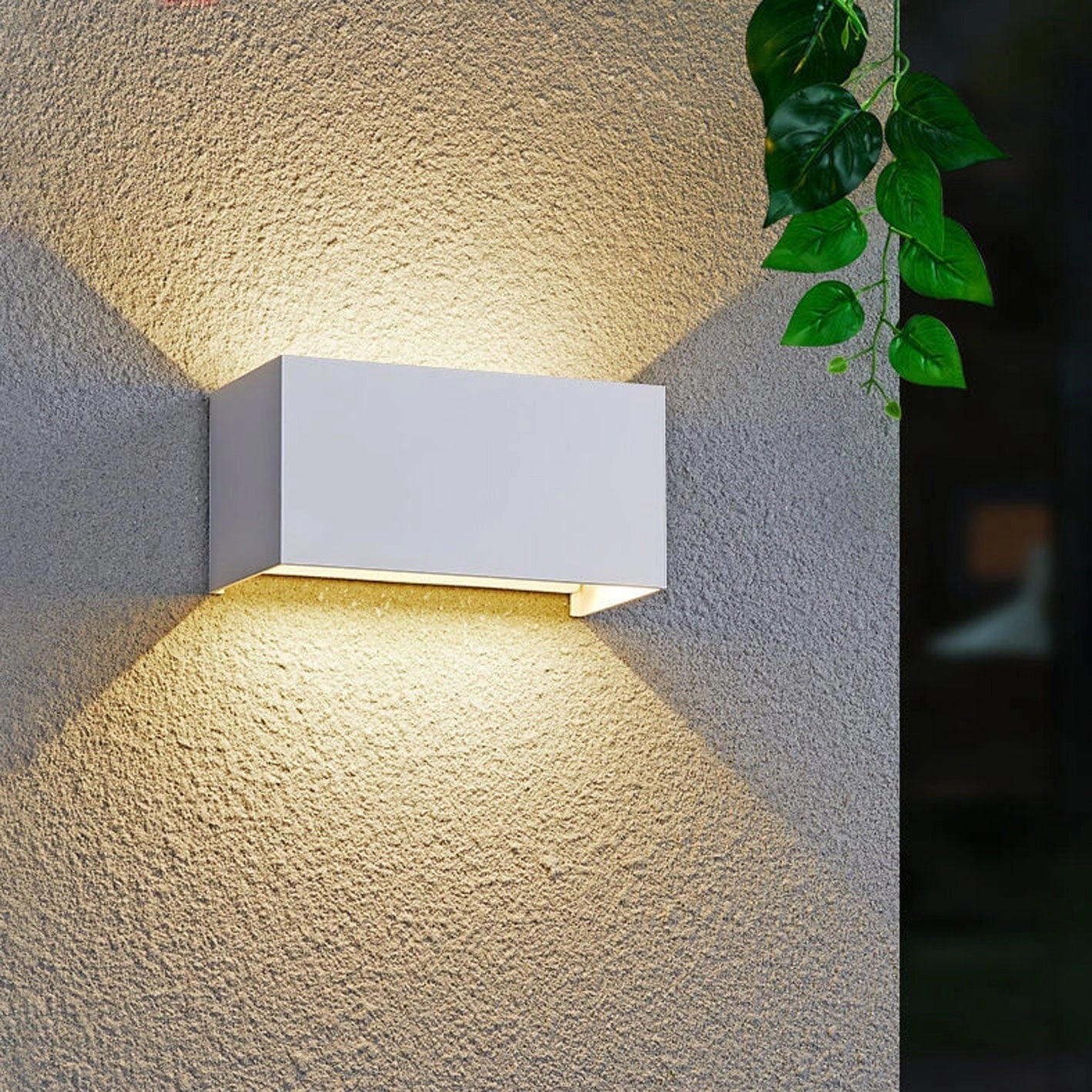 Modern rectangular black LED outdoor wall light with a sleek design, featuring weather-resistant materials that make it suitable for various outdoor settings.