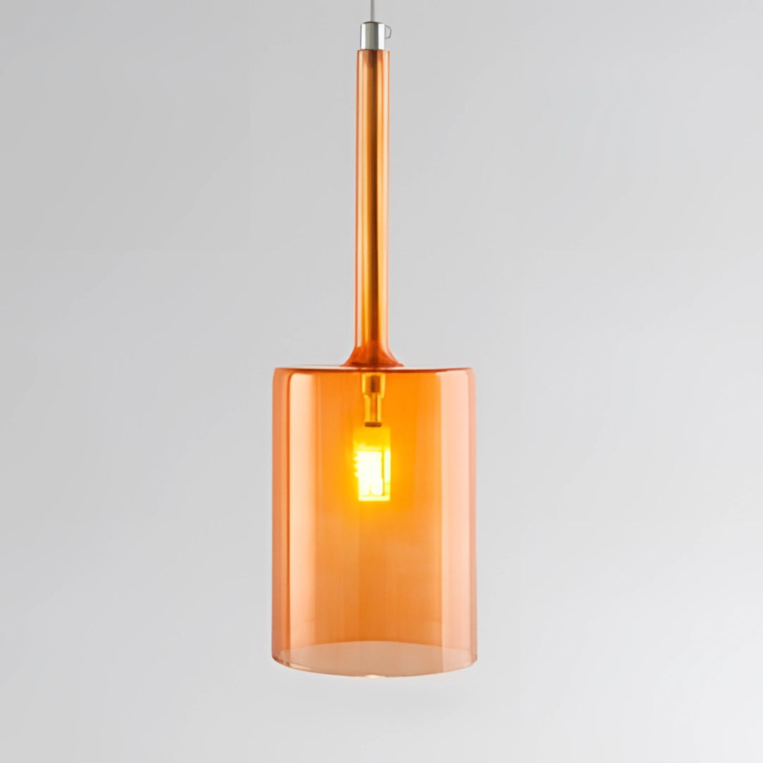 Modern Scandinavian glass pendant light with an amber hue, styled in a B Orange variant, emitting a warm white glow. The design showcases a sleek, rectangular shape with transparent elements, enhancing the luxurious ceiling fixture's appeal.