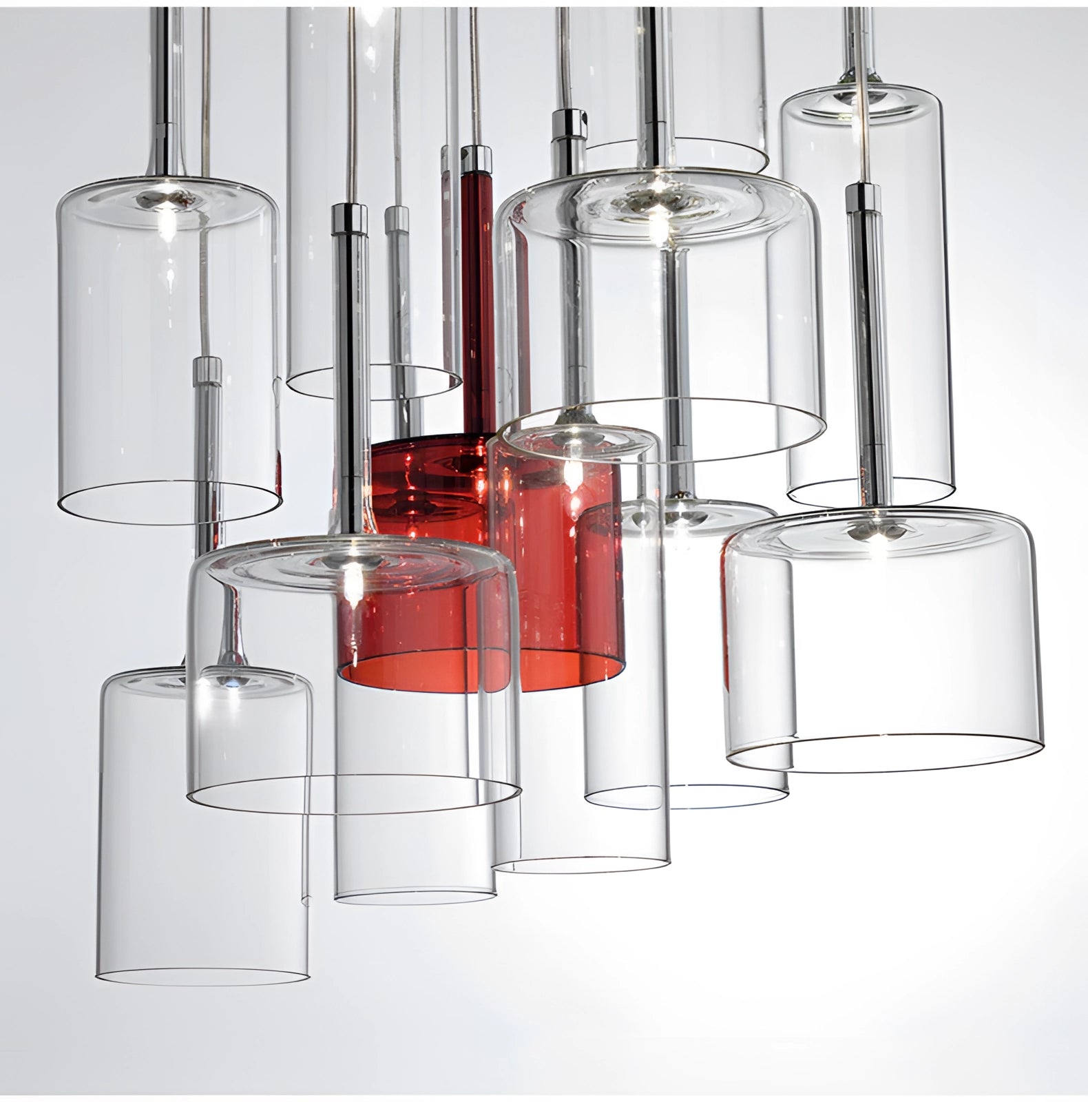 Modern Scandinavian glass pendant lights featuring a sleek cylindrical design, showcasing a minimalist luxury ceiling fixture with translucent glass that enhances ambient lighting.