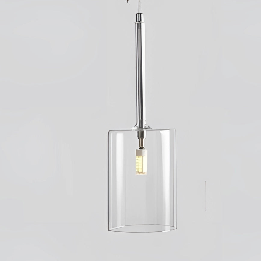 Transparent modern Scandinavian glass pendant light with a warm white glow, featuring a sleek metal ceiling fixture design.