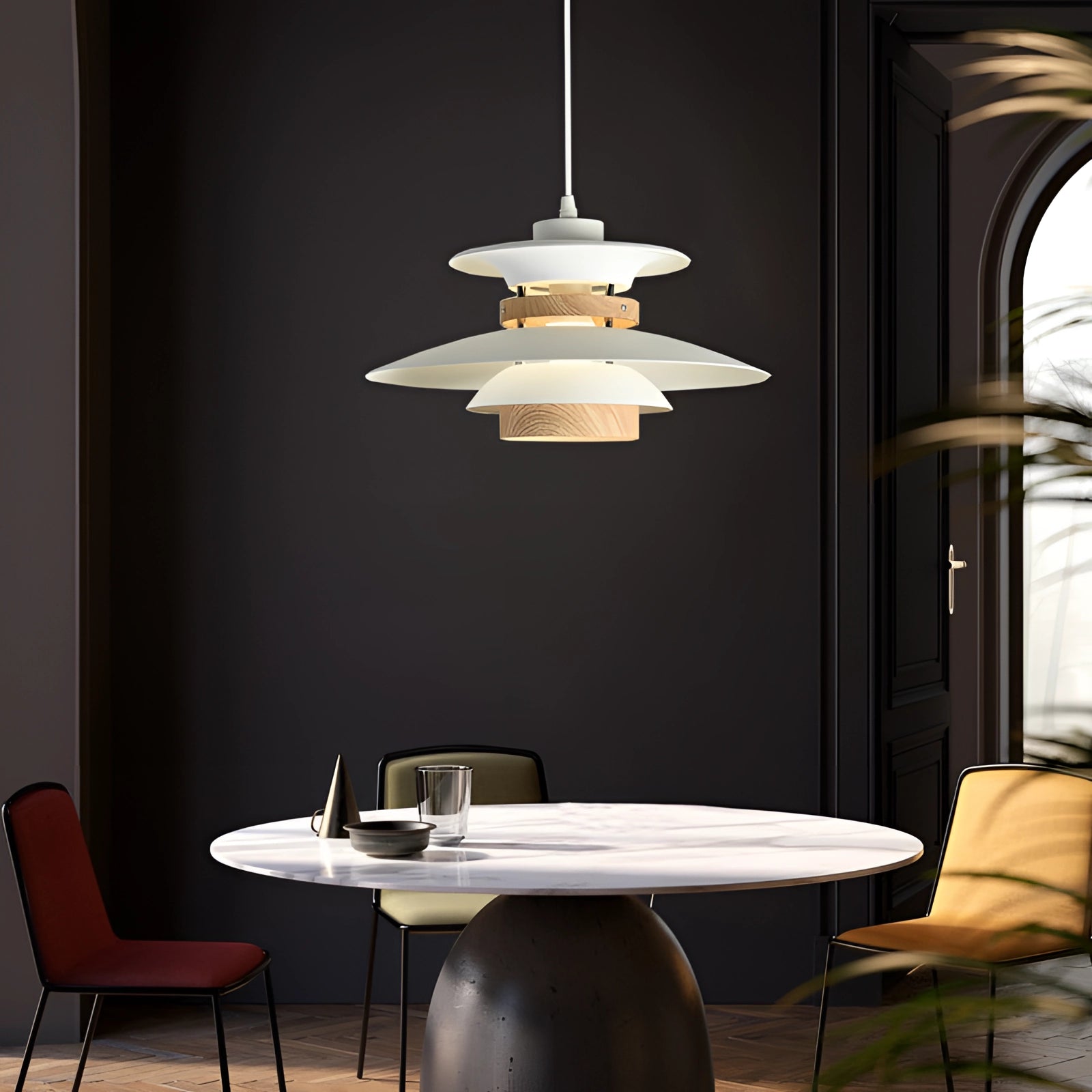 Modern Scandinavian LED pendant light with minimalist wooden design hanging above a wooden table and chairs in a contemporary interior setting.