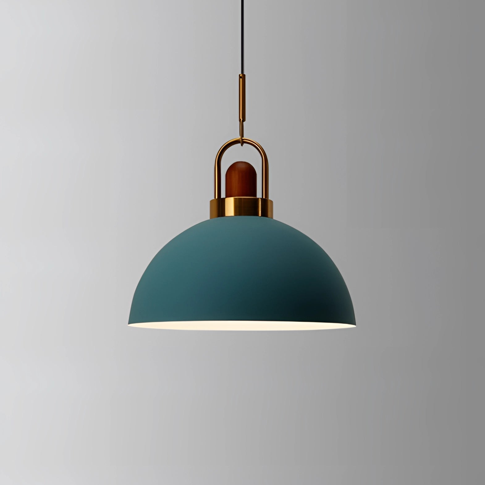 Modern Scandinavian matte blue pendant light with copper accent, featuring a circular metal design, hanging from the ceiling as a stylish and symmetrical light fixture.