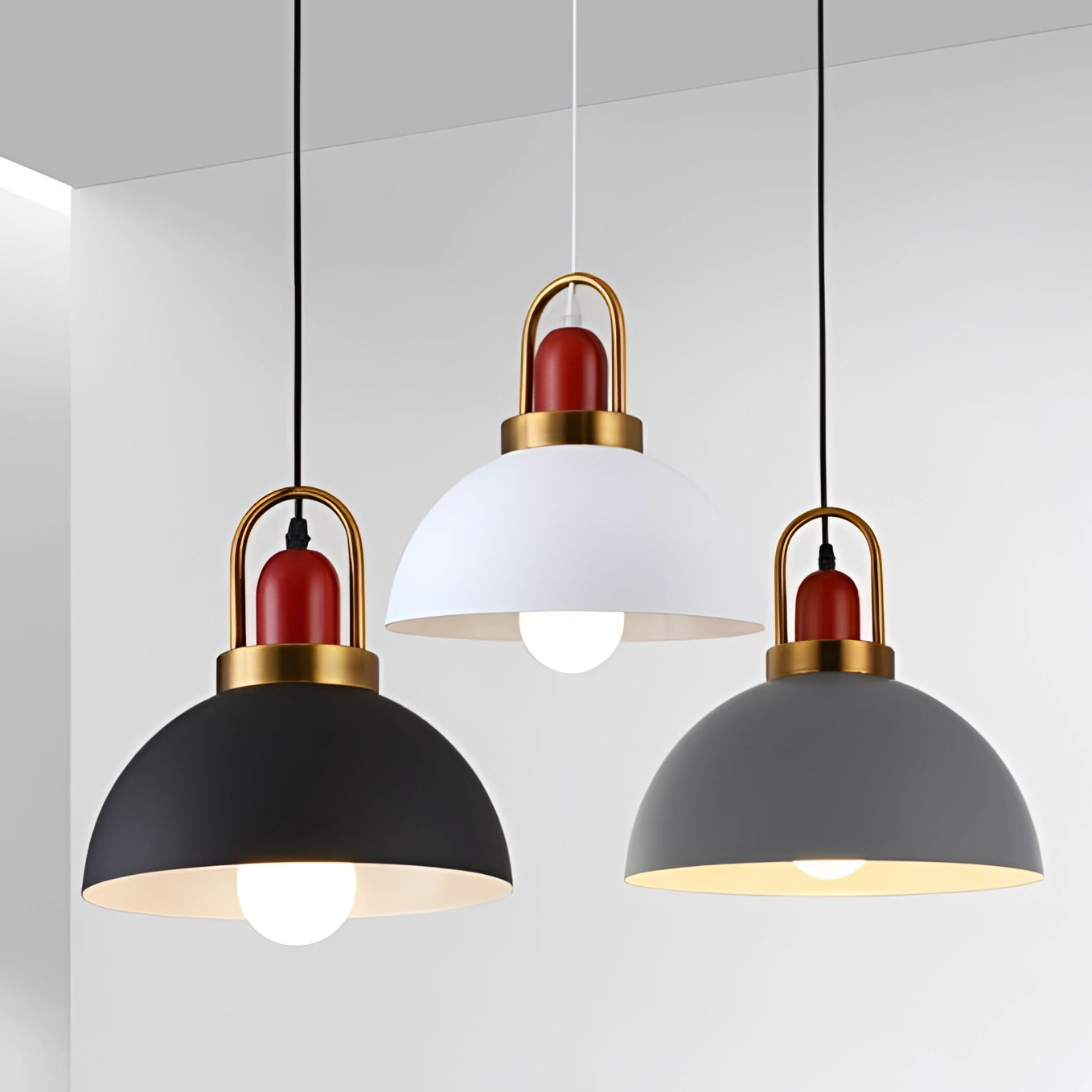 Modern Scandinavian matte pendant lights with copper accents hanging from the ceiling in a stylish interior setting, highlighting minimalist design and providing focused illumination.