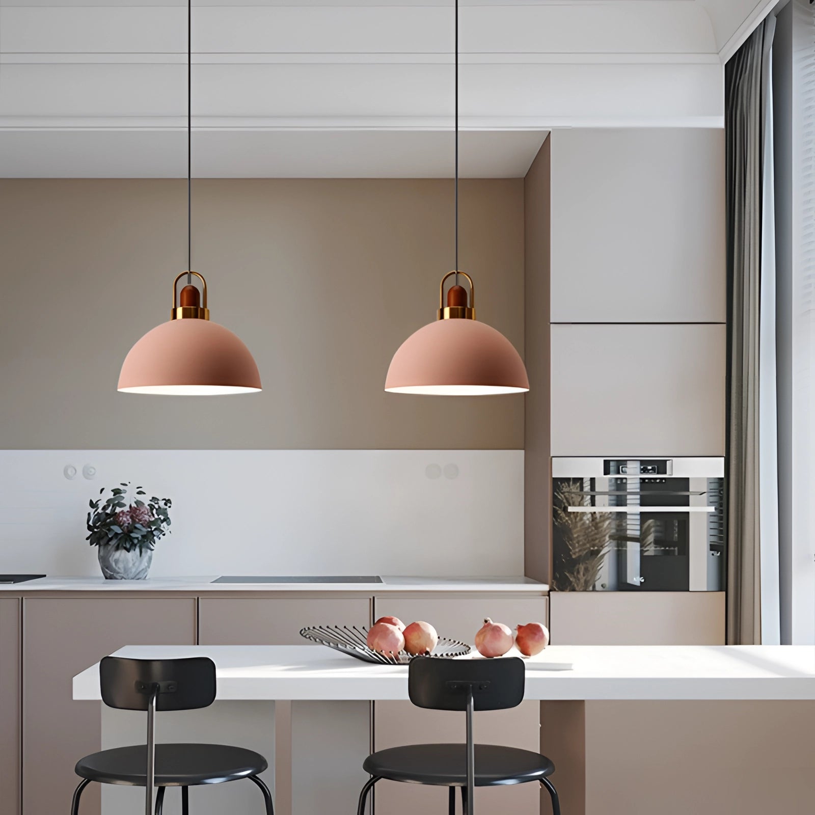 Modern Scandinavian matte pendant lights with copper accents hanging above a wooden table and chairs in a stylishly designed interior space featuring shelves and a flowerpot.