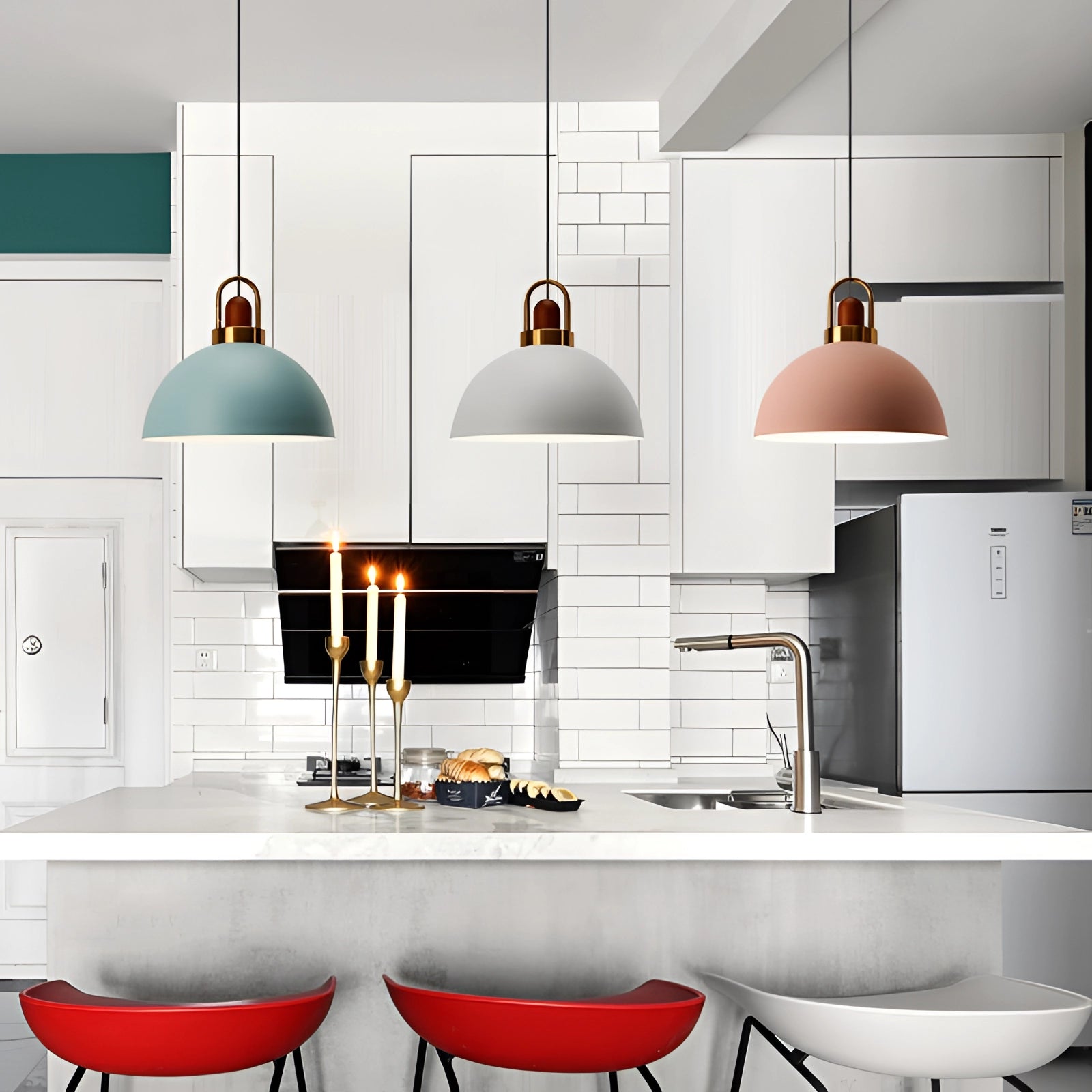 Modern Scandinavian matte pendant lights featuring copper accents, installed in a sleek, contemporary kitchen setting with white cabinetry and shelving, complementing the minimalist interior design.