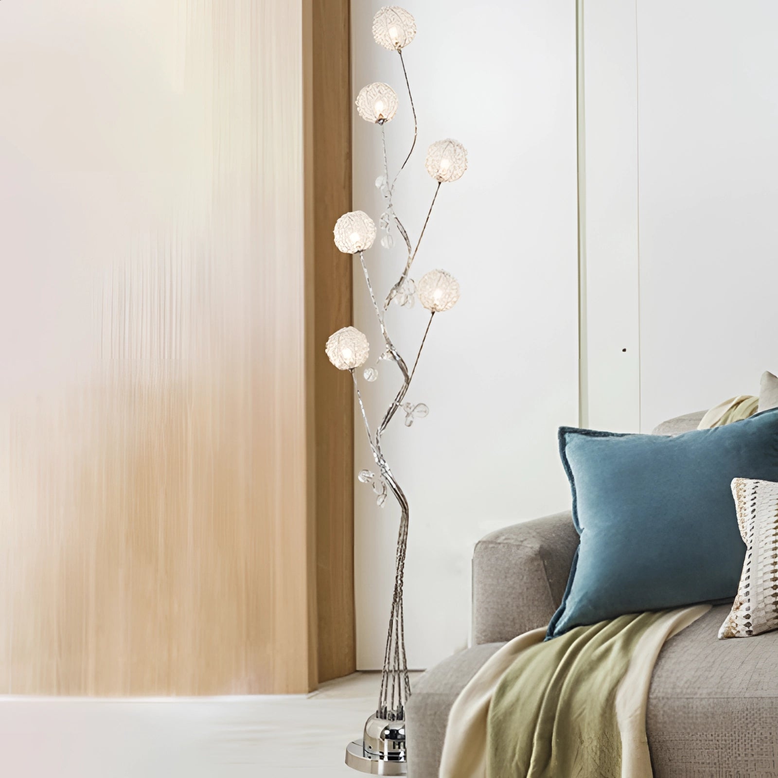 Modern sculptural branch table lamp featuring a unique twig design with a wooden finish, placed on a grey rectangular surface, enhancing artistic home decor lighting.