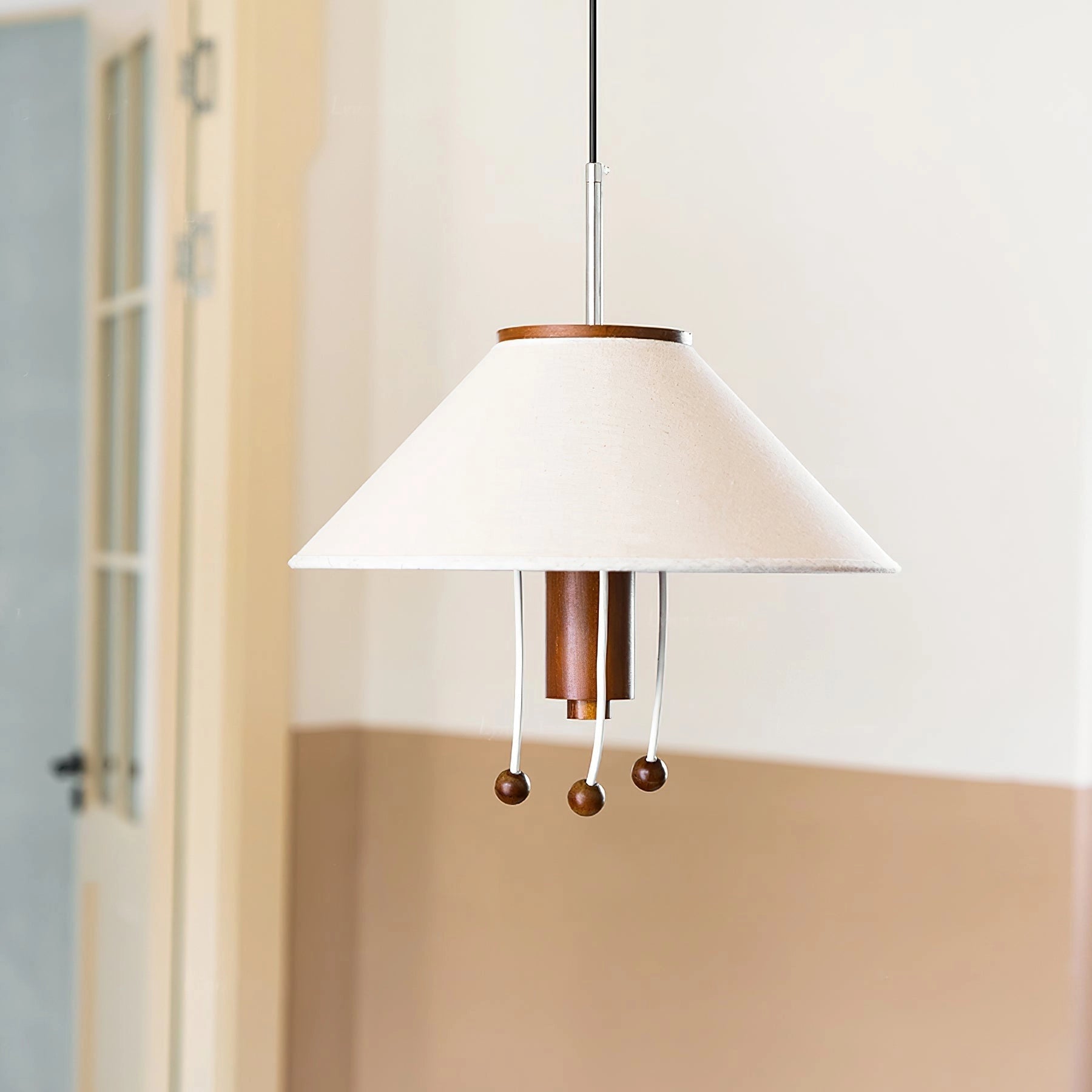 Modern triangle pendant lamp with wooden accents, adjustable lighting, hanging from the ceiling, featuring a glass lampshade and sleek design.