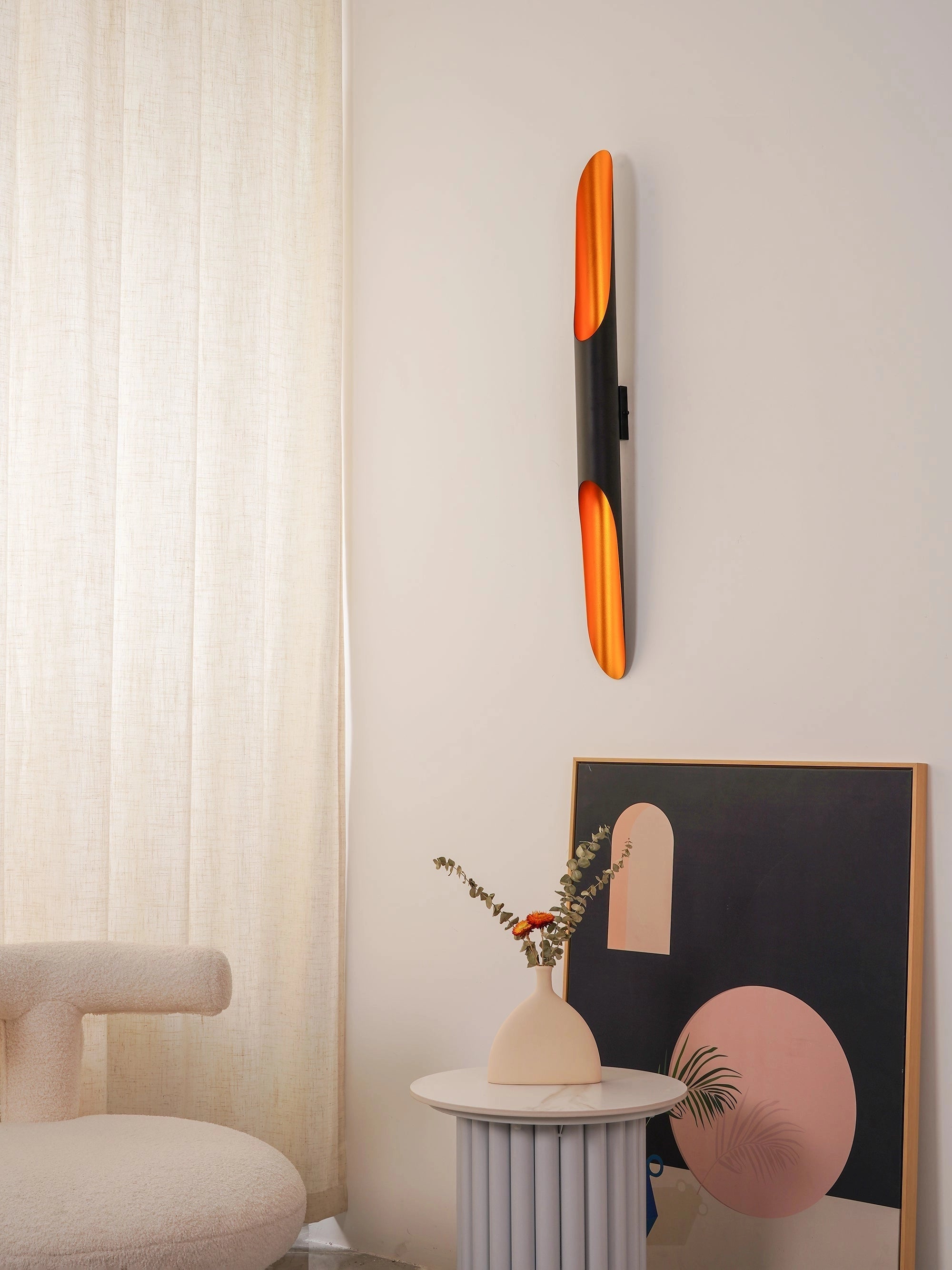 Modern vertical LED wall sconce with a minimalist architectural design, featuring a warm orange glow against a wooden background, highlighting its sleek lines and material properties, suitable for room lighting and artistic decor.