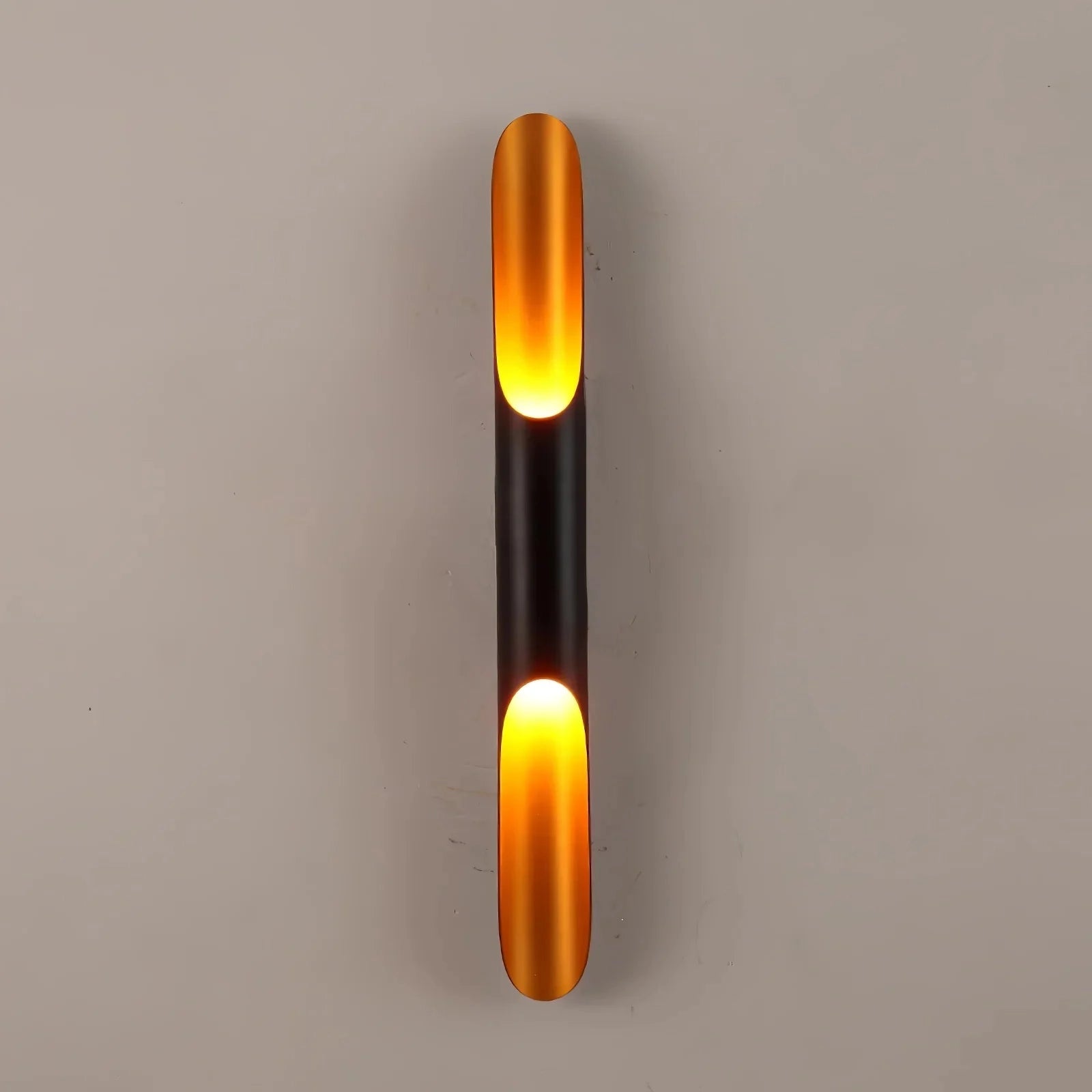 Modern vertical LED wall sconces in a minimalist architectural design, featuring a matte black finish with a cylindrical shape and a diameter of 8 cm by a height of 100 cm. Set of two lights emitting a soft, ambient glow.