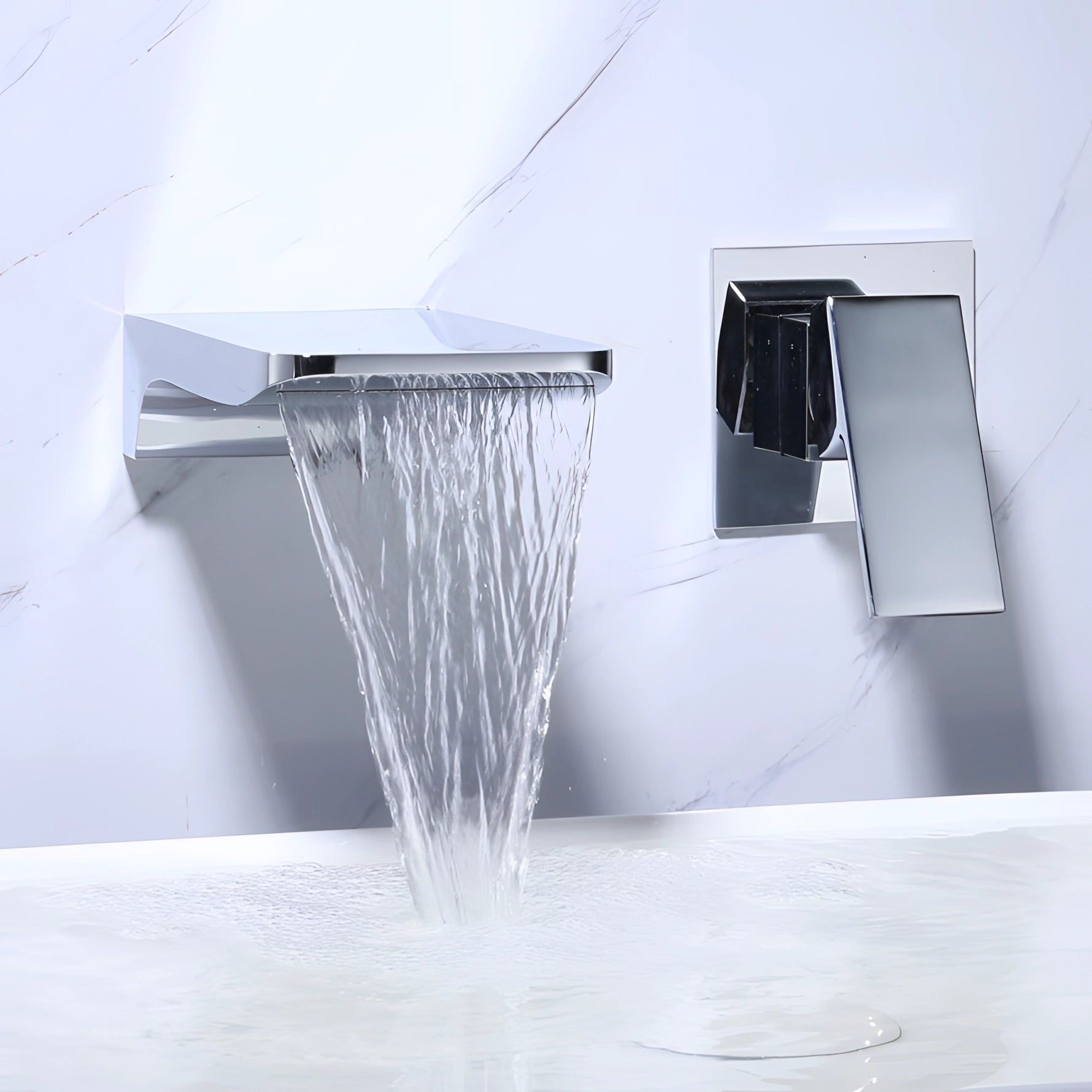 Modern square-shaped wall-mounted waterfall faucet with a chrome finish, installed on a grey wooden wall and surrounded by glass elements, featuring a sleek and contemporary bathroom design.