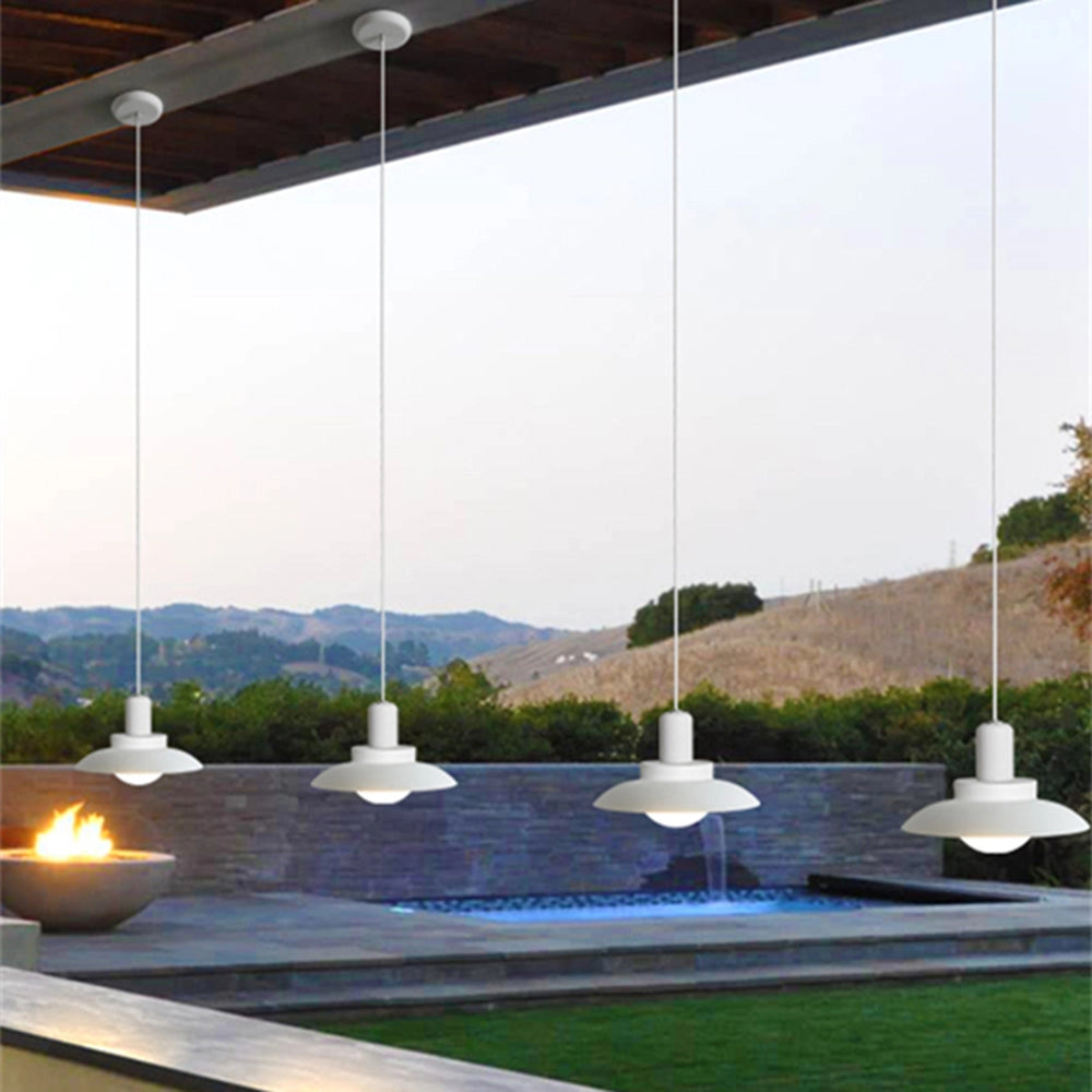 Modern white pendant light hanging in a minimalist kitchen setting, featuring an adjustable design with a sleek, contemporary aesthetic.