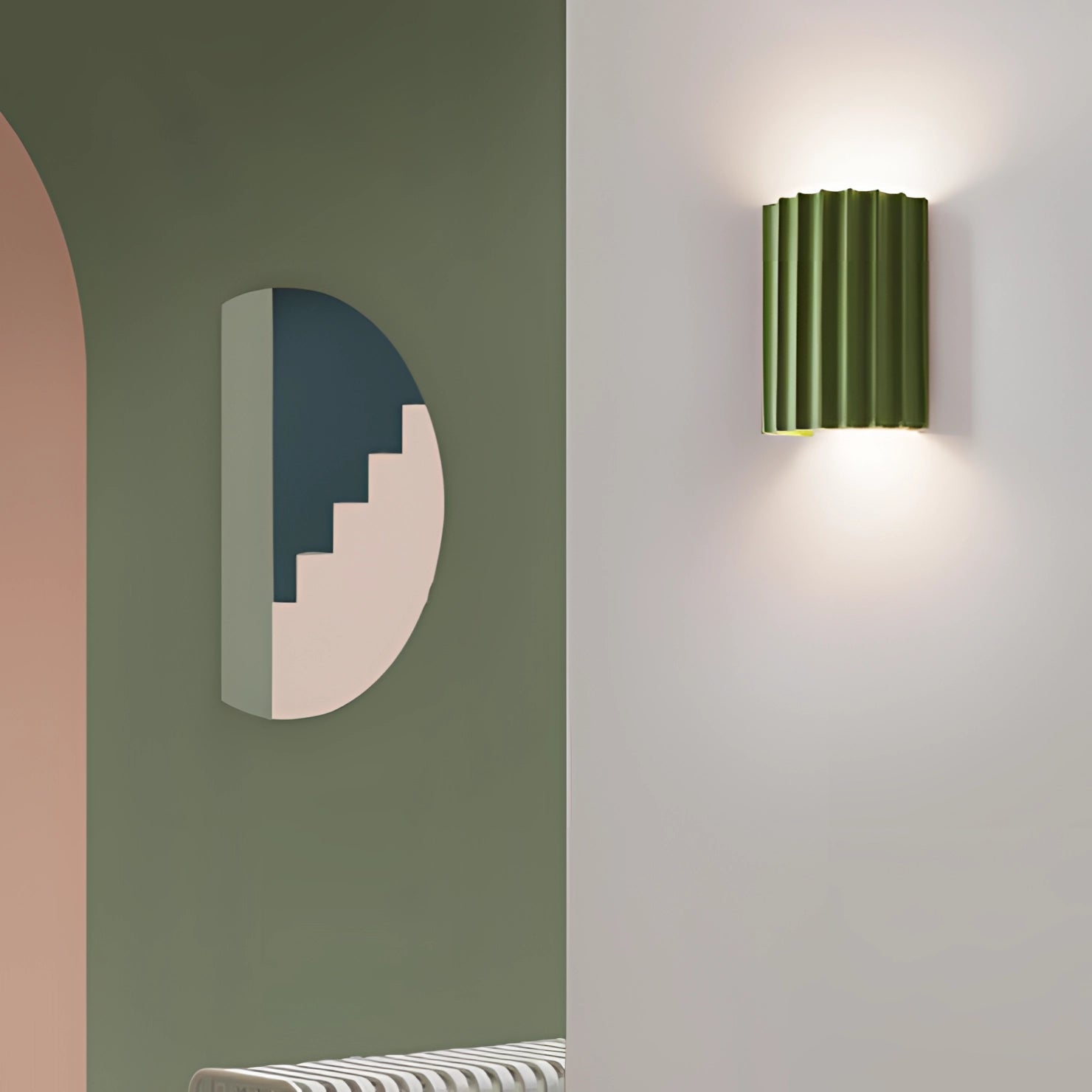 
A modern white ribbed wall sconce with a contemporary design, featuring a rectangular and cylindrical shape with subtle tints and shades, suitable for indoor lighting.