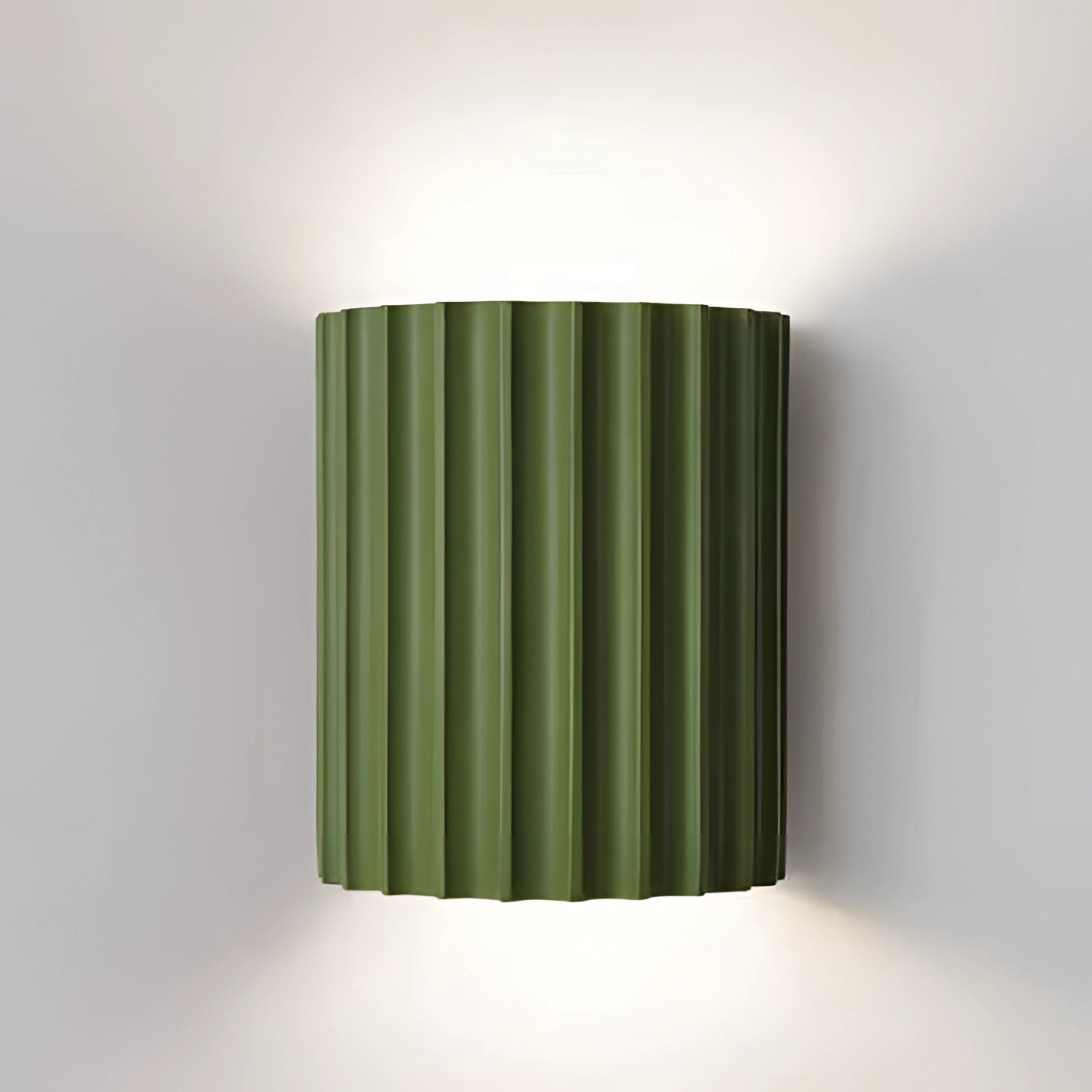 Modern white ribbed wall sconce with a green accent, designed for contemporary indoor lighting. It features a sleek cylindrical shape with a ribbed texture, suitable for 110 V-120 V electrical systems in the USA and Canada. The sconce is crafted from composite materials, blending paper and wood elements, providing an elegant and minimalist aesthetic.