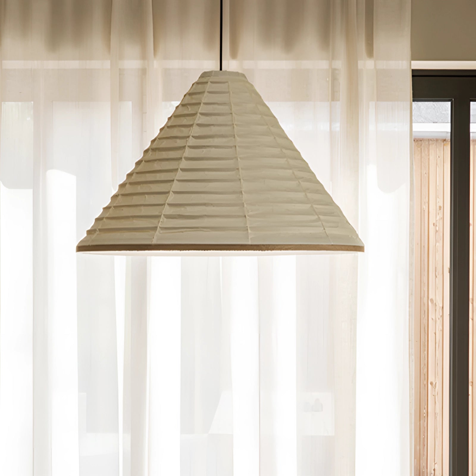 Modern white Scandinavian cone pendant light with a minimalist design, featuring a wooden accent and a sleek shade, suspended from the ceiling.