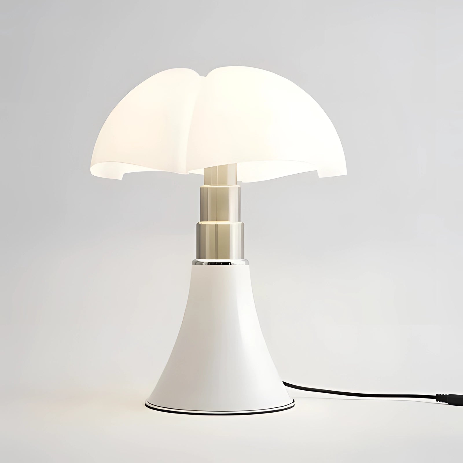 Modern white table lamp with a contemporary minimalist mushroom design, featuring a sleek white lampshade and a simple, elegant base.