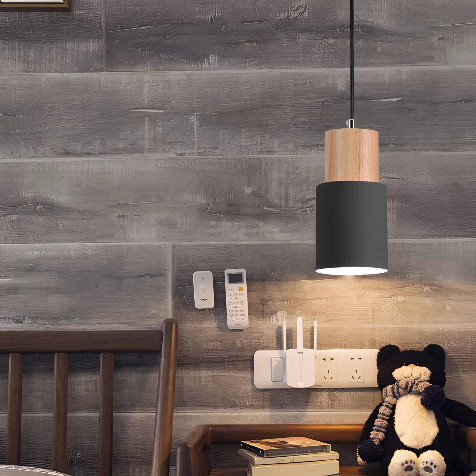 Nordic Modern Pendant Light with a Scandinavian style featuring a wood accent, hanging from the ceiling in a well-lit room.