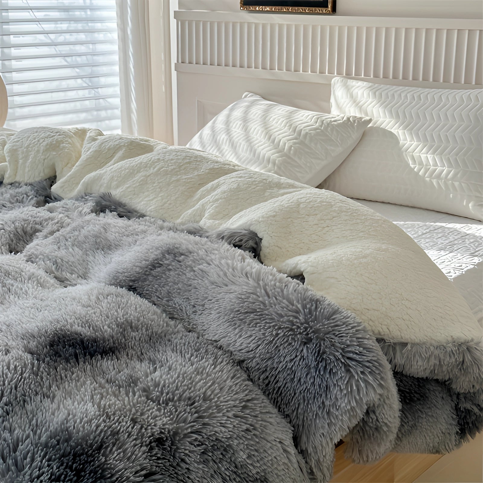 Pastel faux fur blanket draped over a bed in a cozy room, showcasing its multicolor fluffy texture and comfort-enhancing qualities.