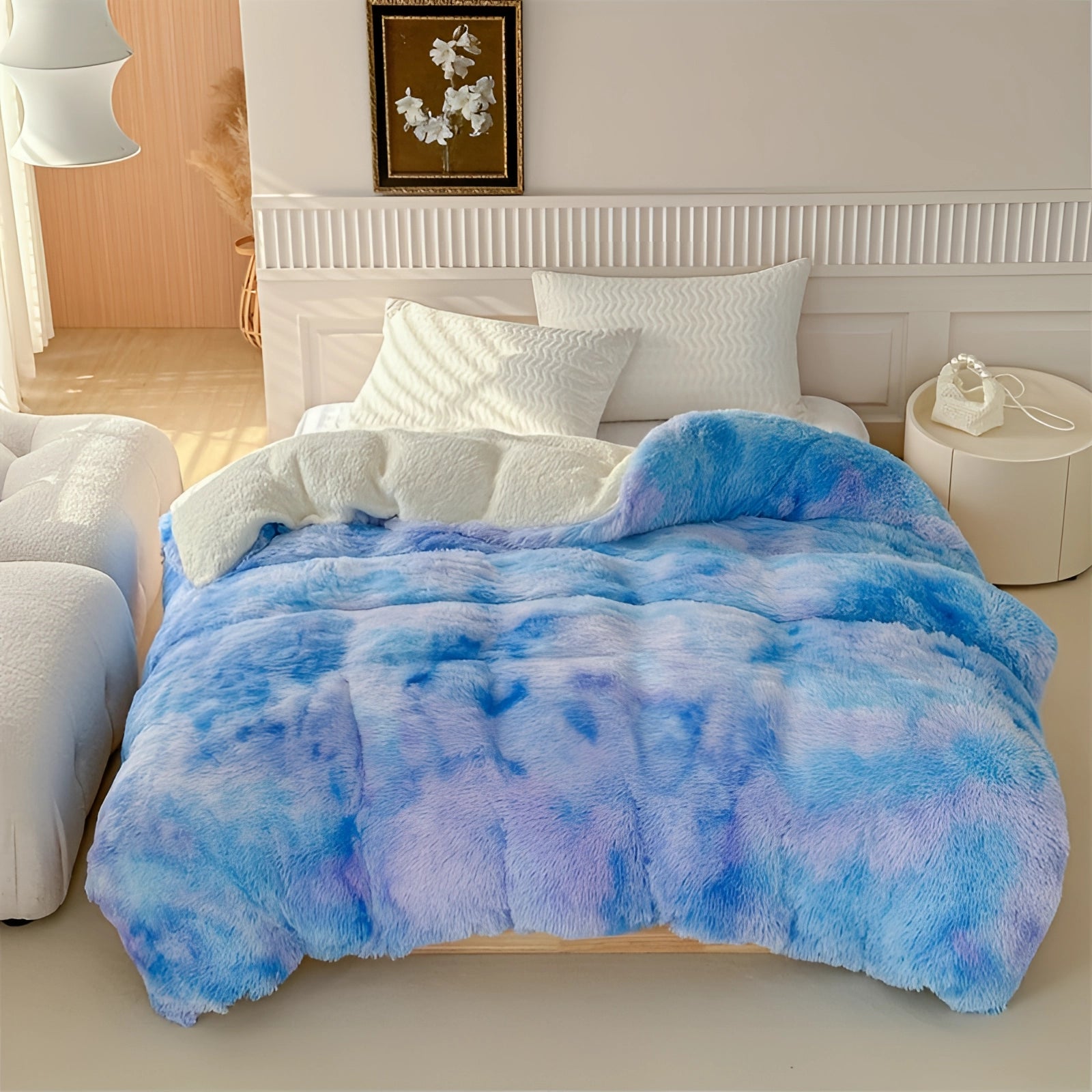 Pastel faux fur blanket in multicolor, predominantly blue, draped over a couch in a cozy interior setting, featuring soft textures that enhance the comfort and style of the space.