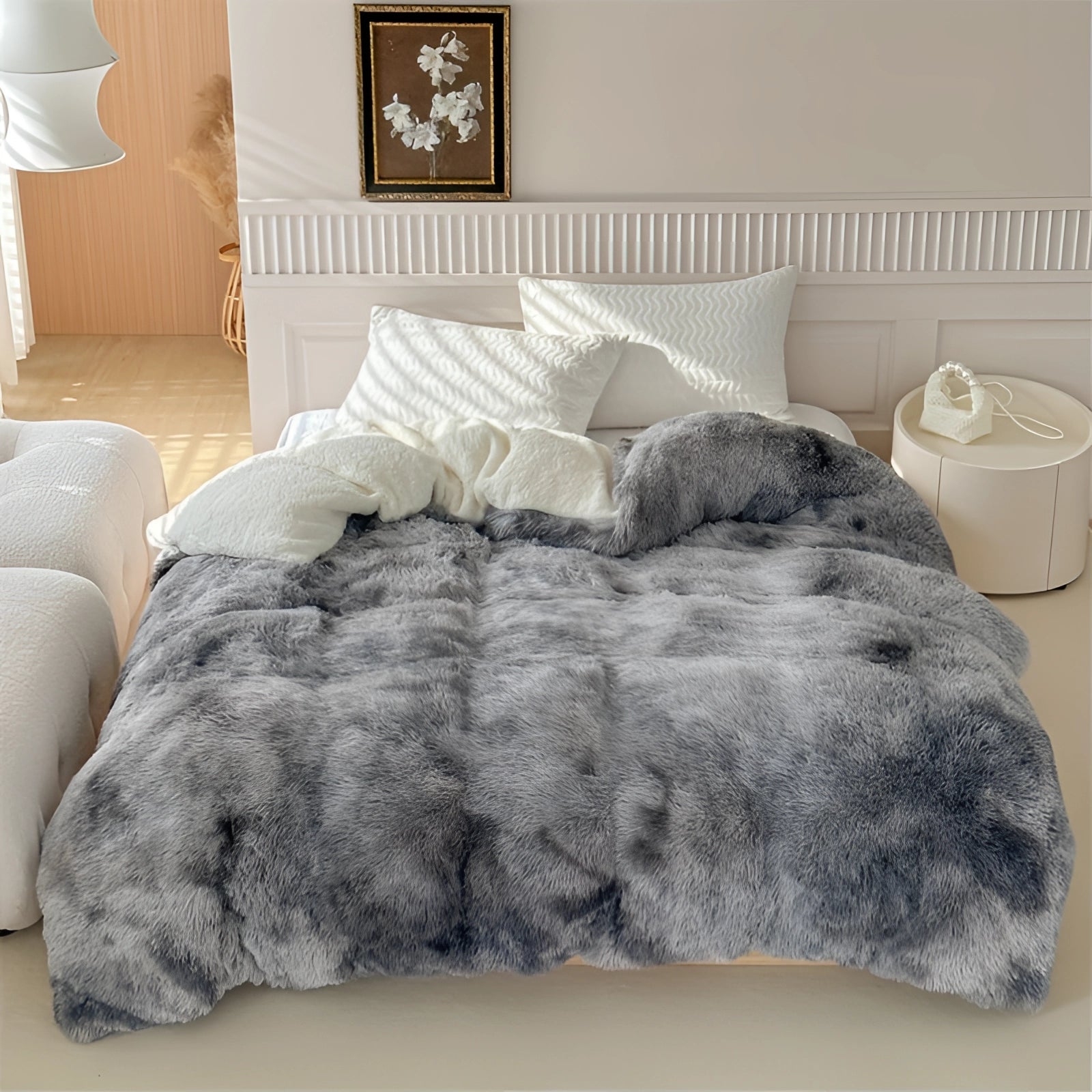 Pastel faux fur blanket in multicolor draped over a studio couch in a living room setting, showcasing a fluffy texture in shades of grey, complementing the wooden flooring and ambient lighting.