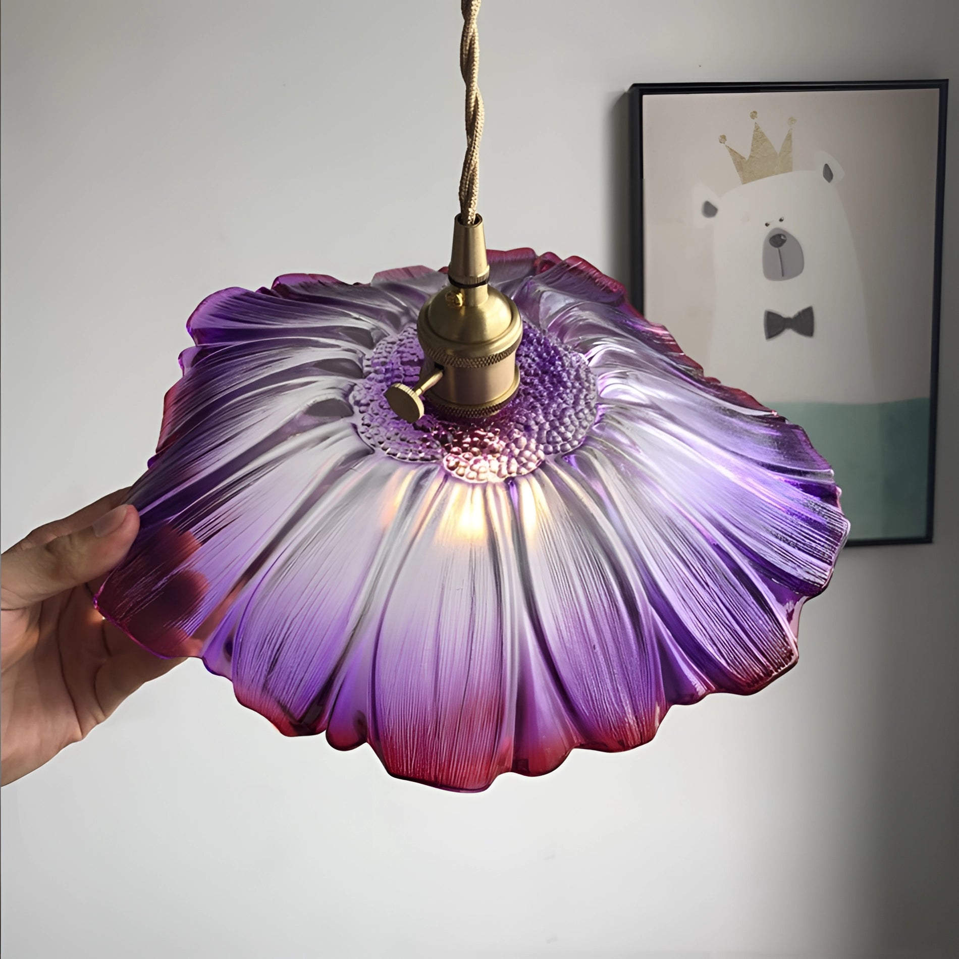 Purple flower-shaped handblown glass pendant light featuring intricate petal designs with shades of violet, pink, and magenta.