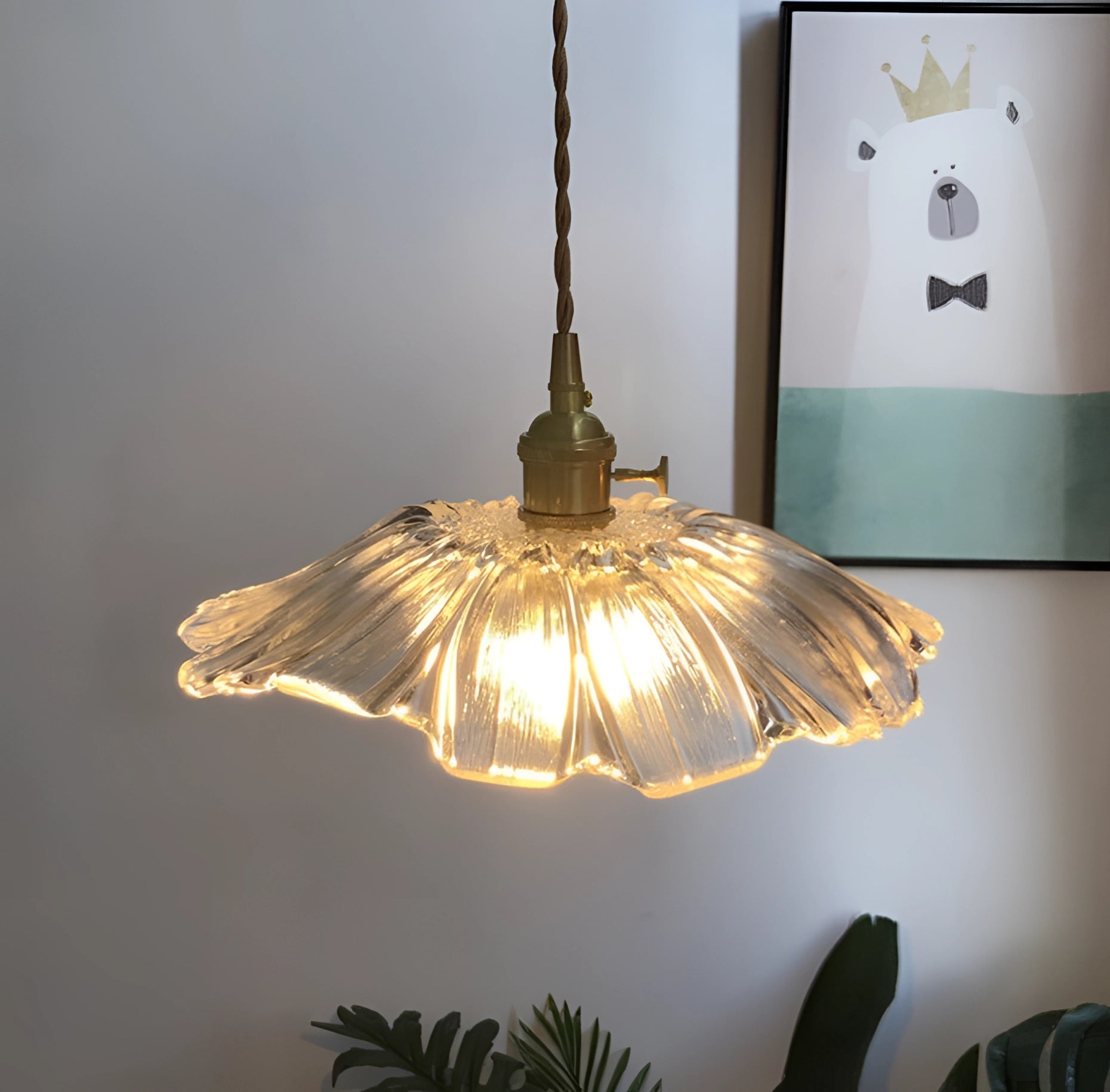 Purple handblown glass pendant light with a flower-inspired design, featuring an artistic and elegant ceiling fixture with metal accents and a stylish lampshade.