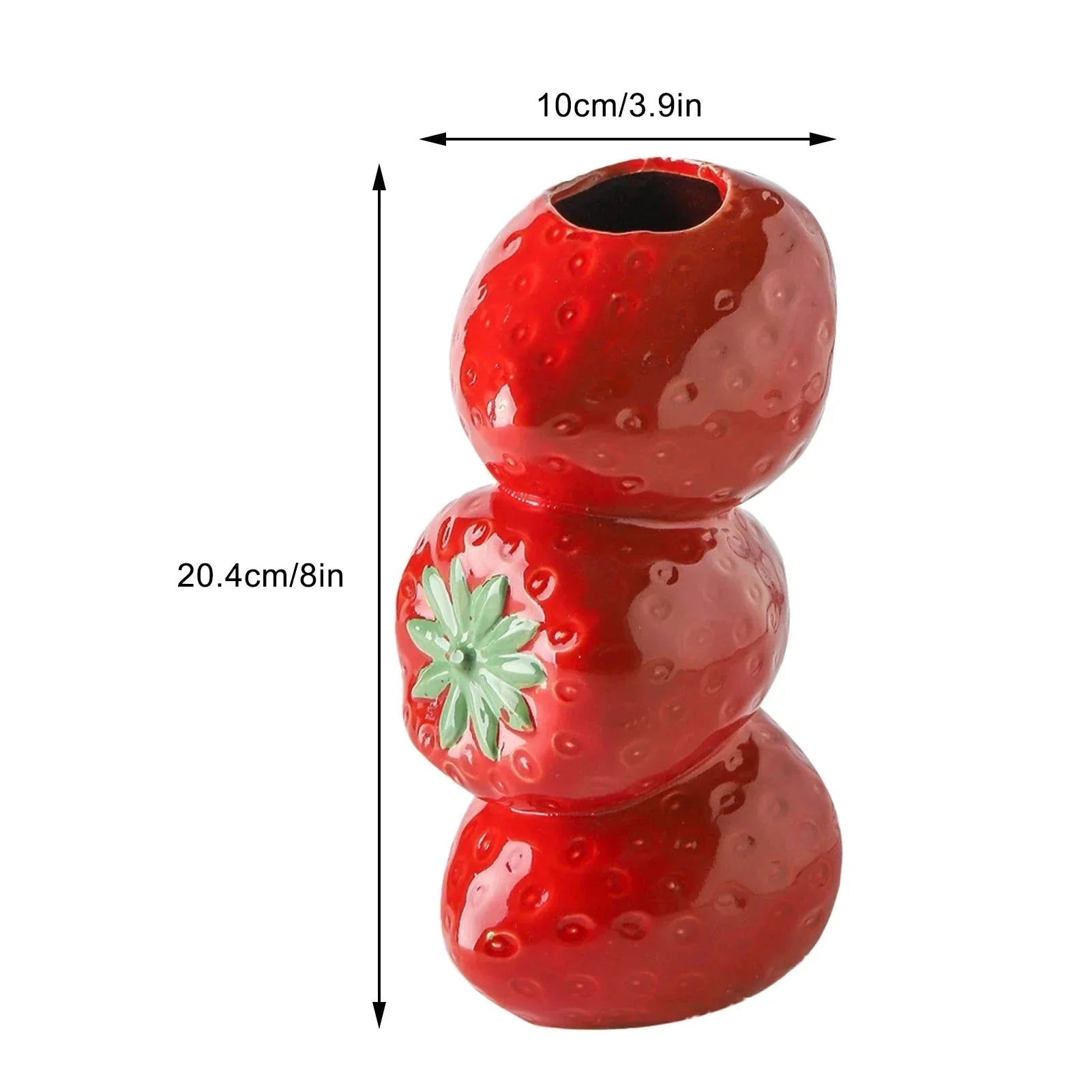 A vibrant red ceramic vase shaped like a strawberry, featuring realistic fruit details and a glossy finish. Ideal for adding a playful, fruit-themed element to your home decor.